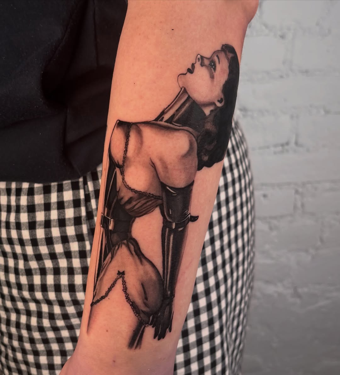 Woman in lingerie realism tattoo on the forearm by laura bianca