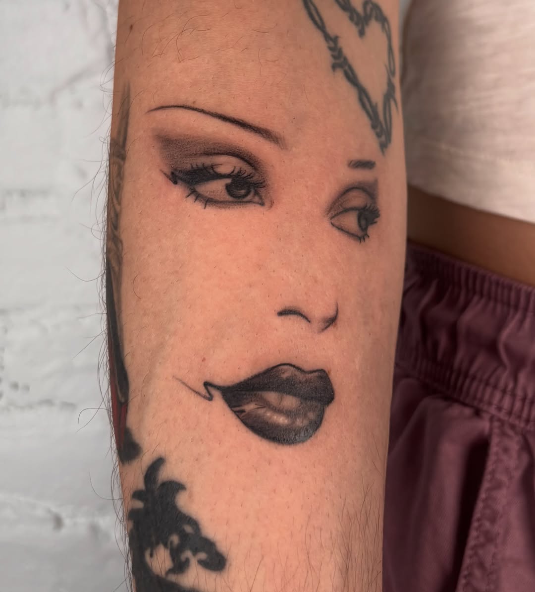 Woman's face realism tattoo on the forearm by laura bianca