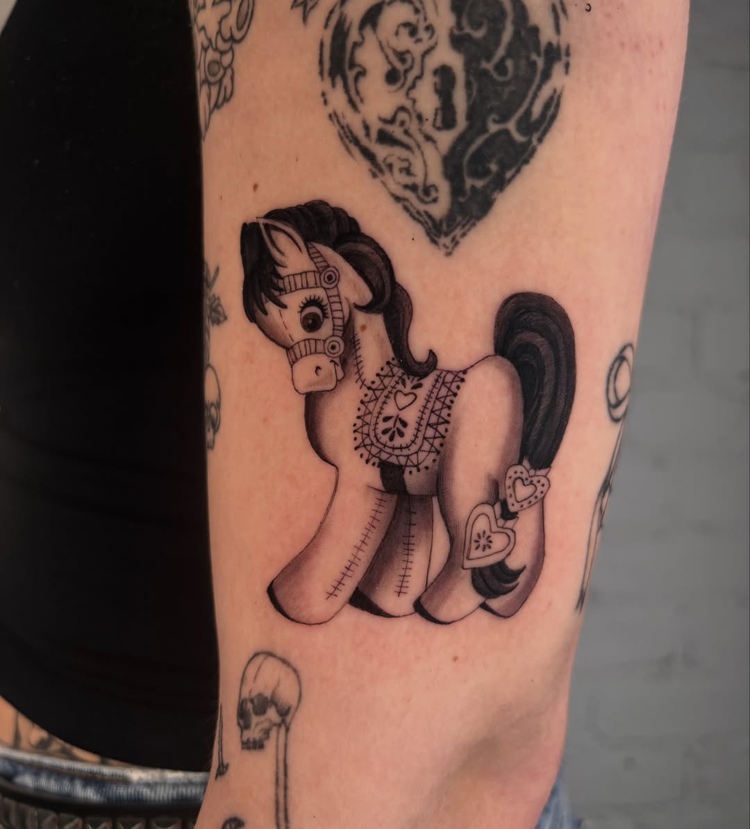 My little pony black and grey tattoo on the forearm by laura bianca