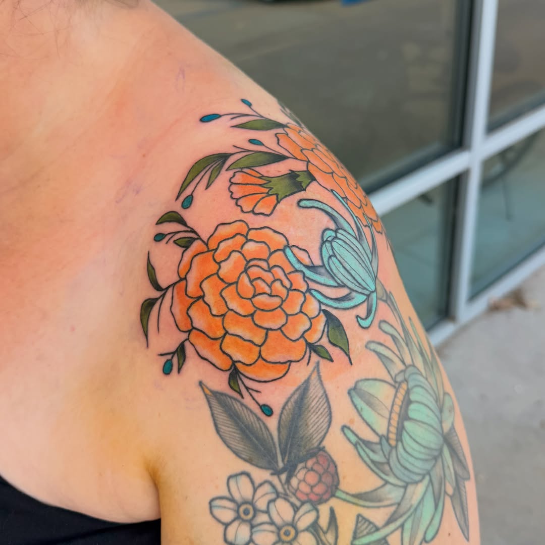 Floral bouquet American traditional tattoo on the shoulder by Lexi Odam
