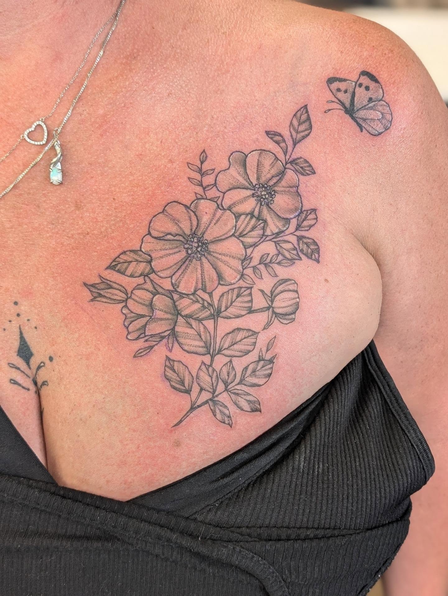 Flowers and butterfly black and grey tattoo on the shoulder by Devon Ward, Portland, Oregon
