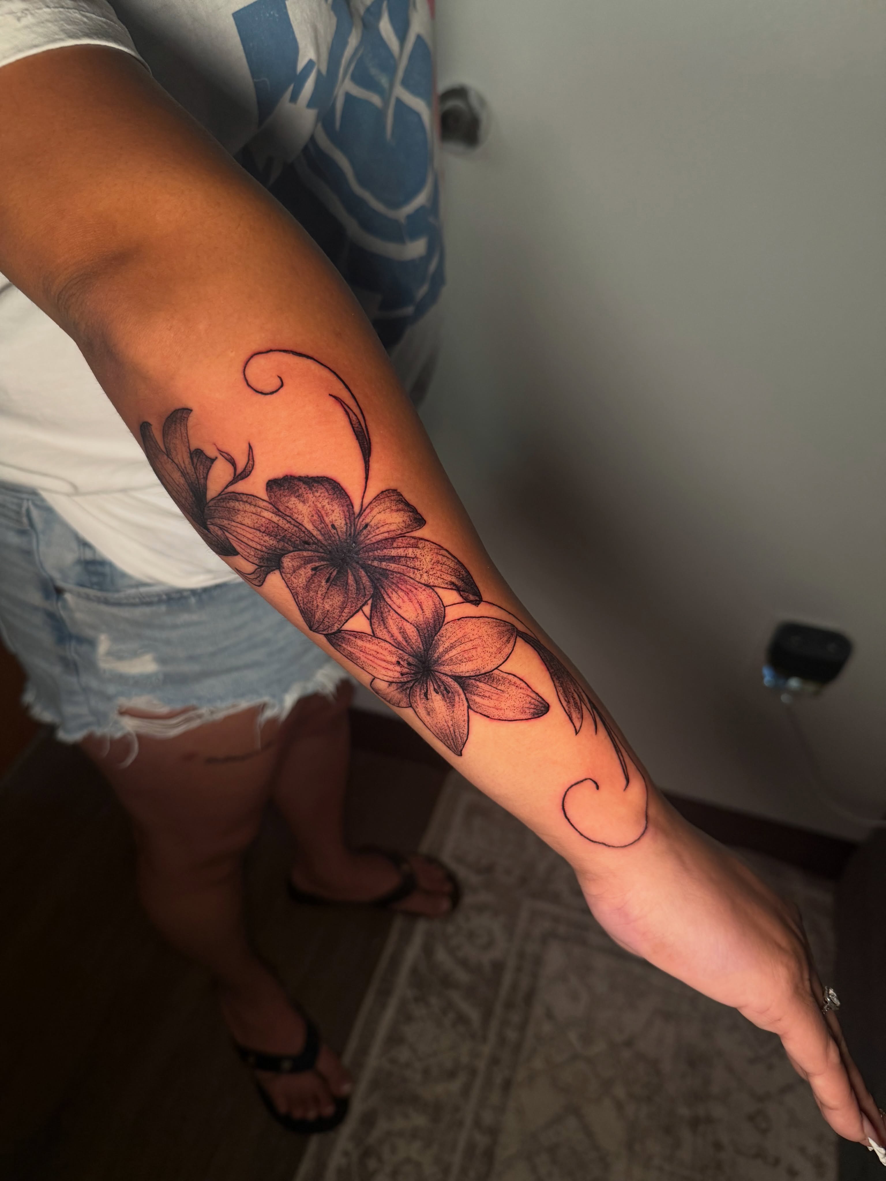 Flowers black and grey tattoo on the forearm by Sebastian martinez, Memphis, Tennessee