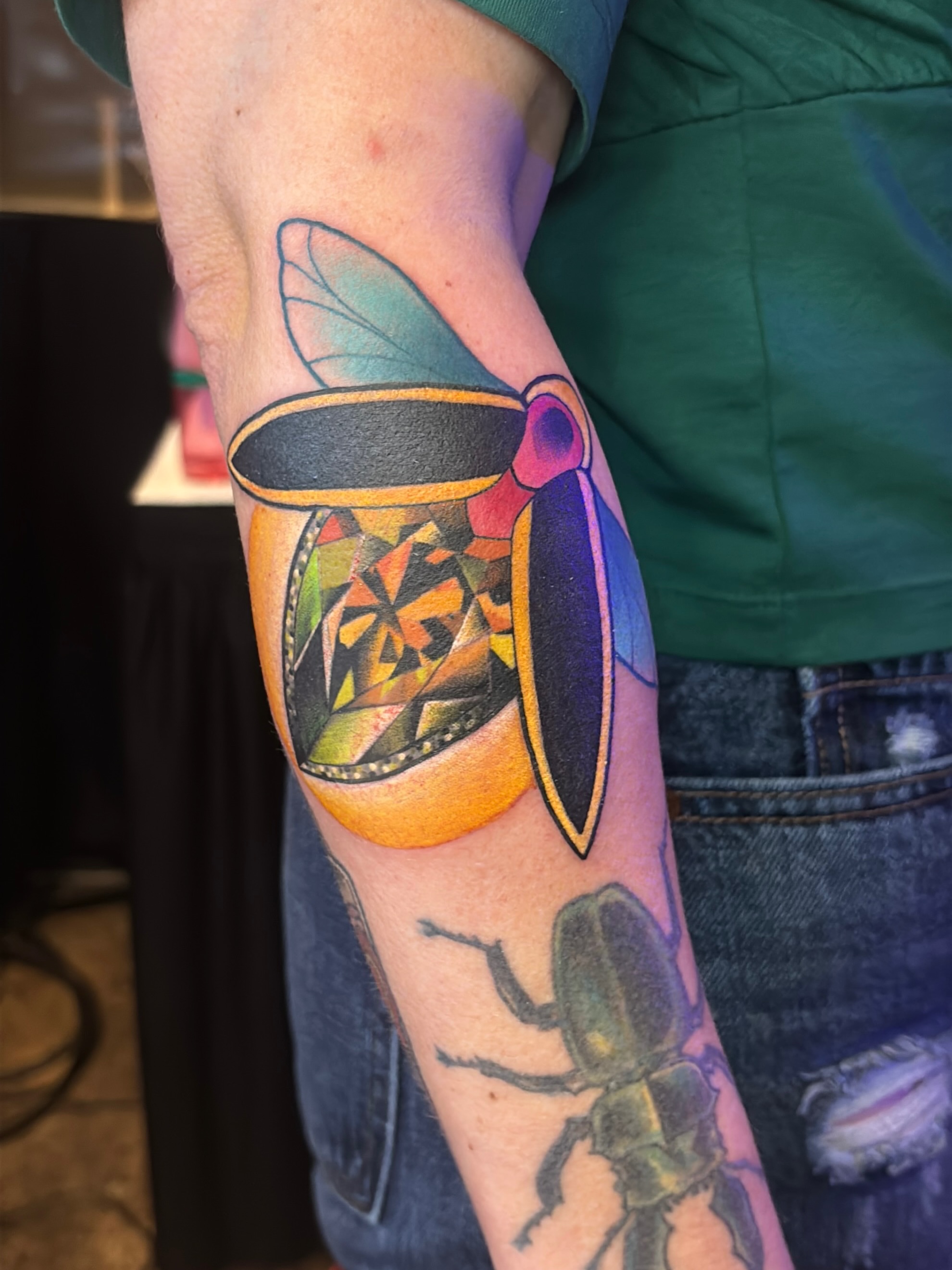 Beetle geometric tattoo on the forearm by Latesha Burnley