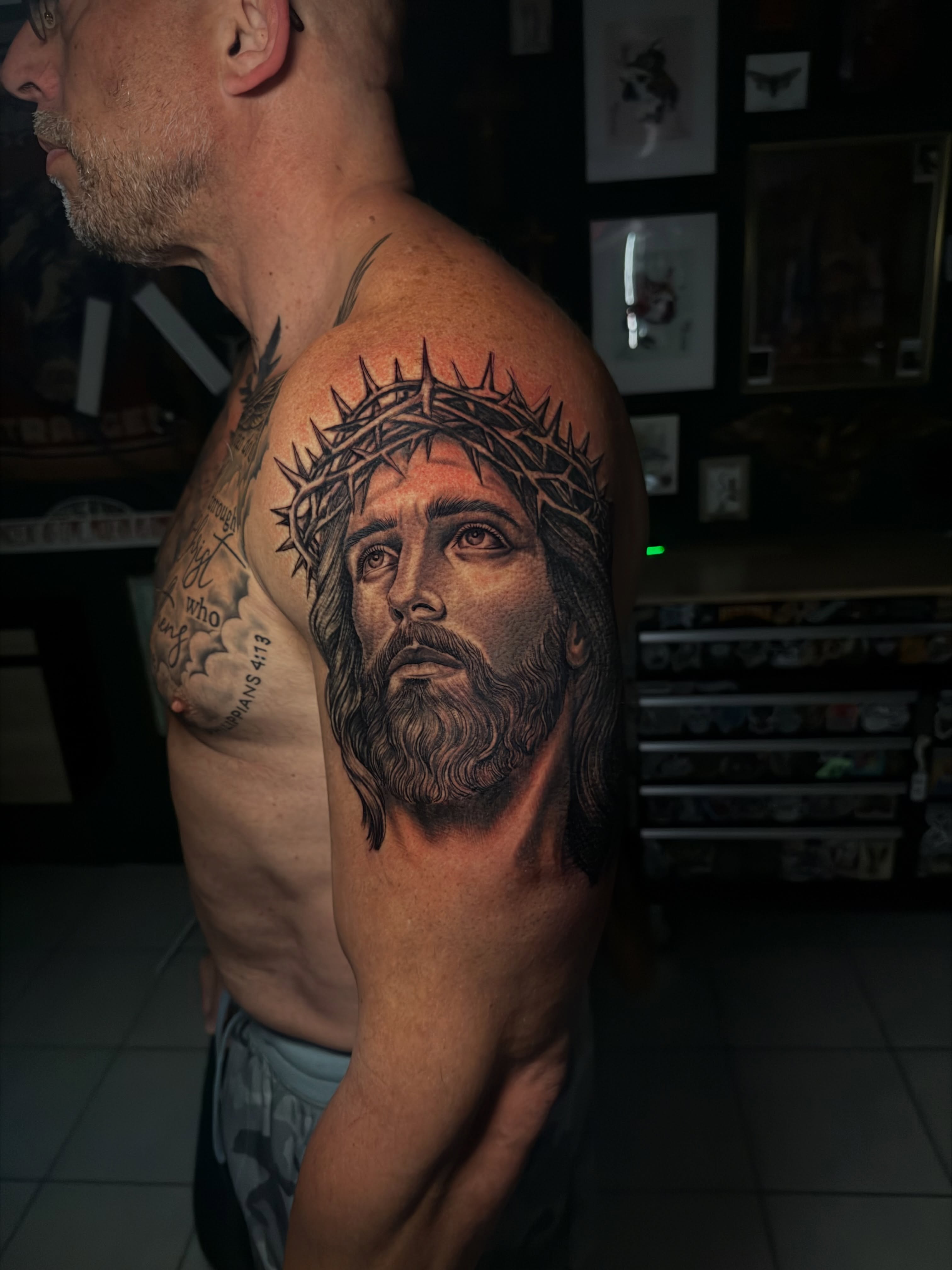 Religious figure realism tattoo on the shoulder by Alex