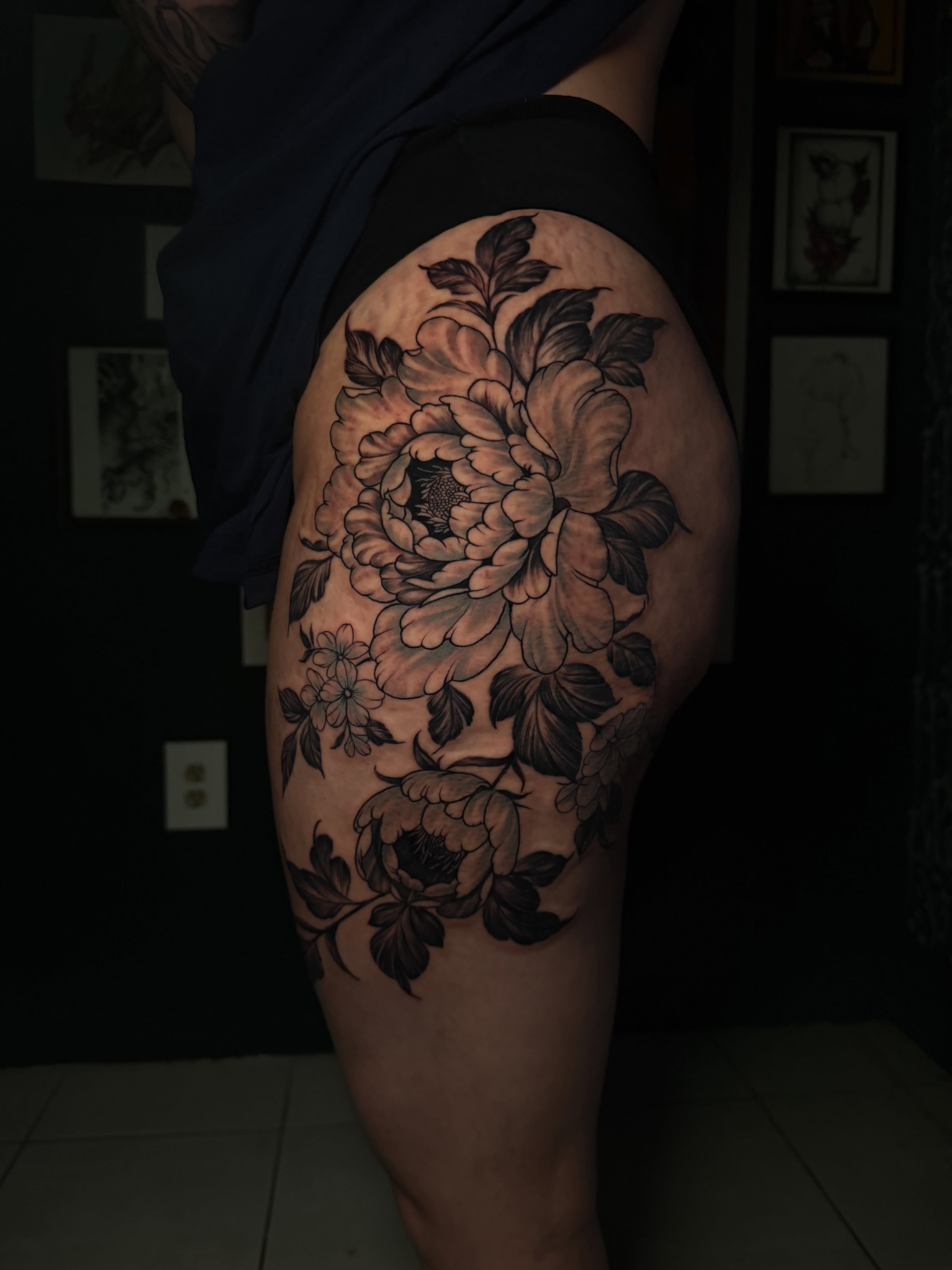 Peony flowers black and grey tattoo on the thigh by Alex