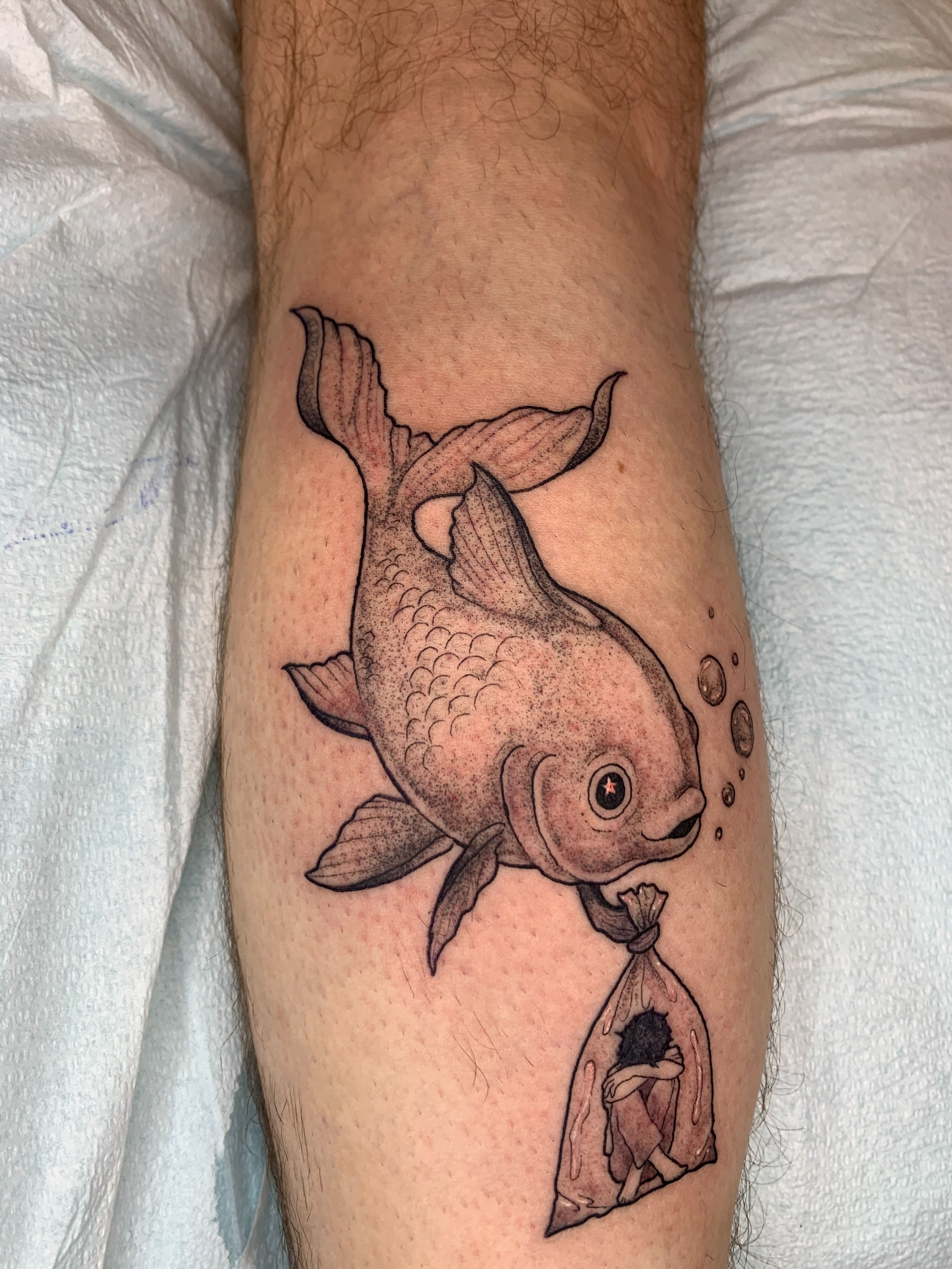 Goldfish and bag dotwork tattoo on the forearm by Kitty Jones, Berkeley, California
