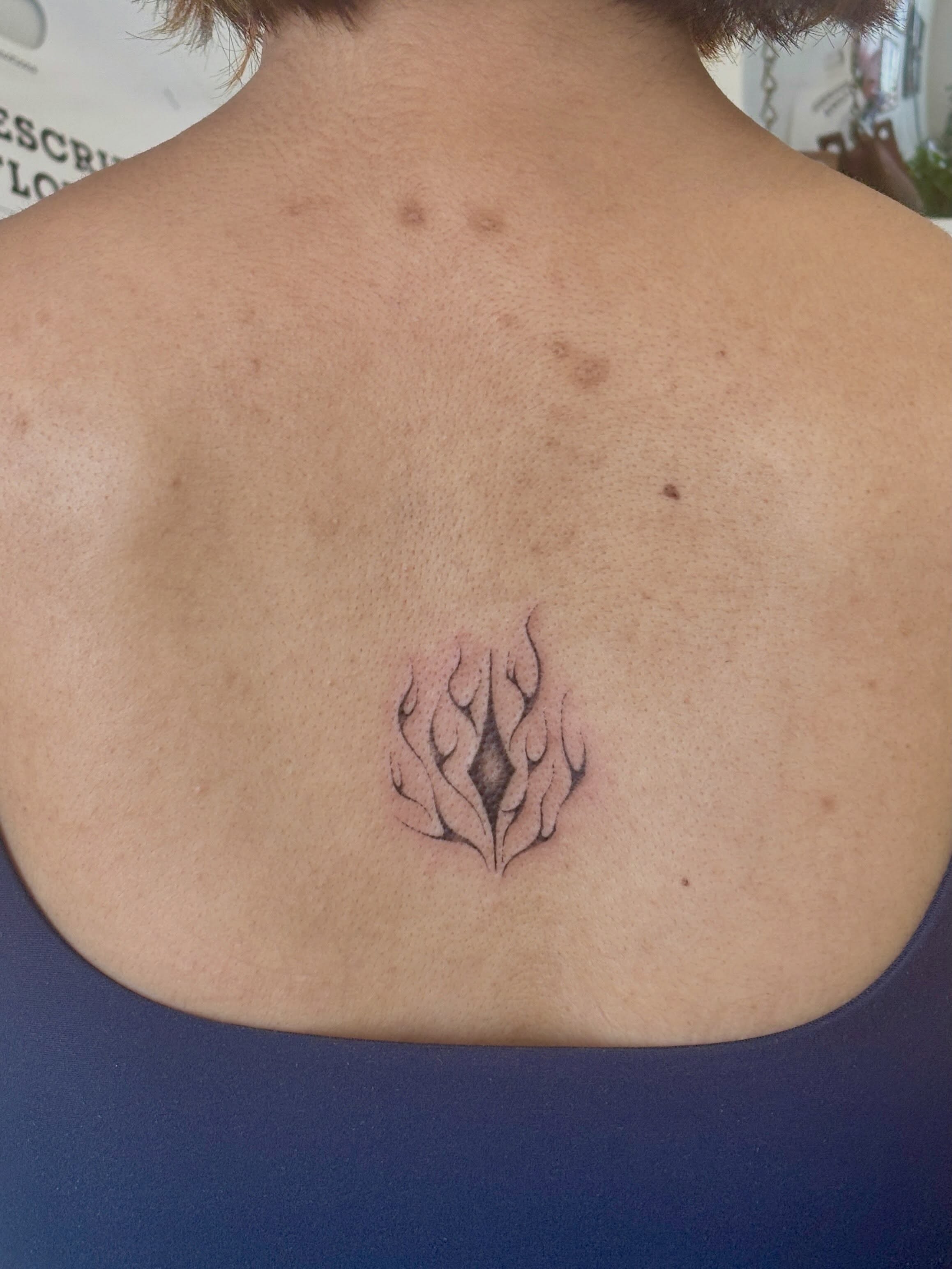 Flame geometric tattoo on the back by ꜱʜɪʀʟᴇʏ