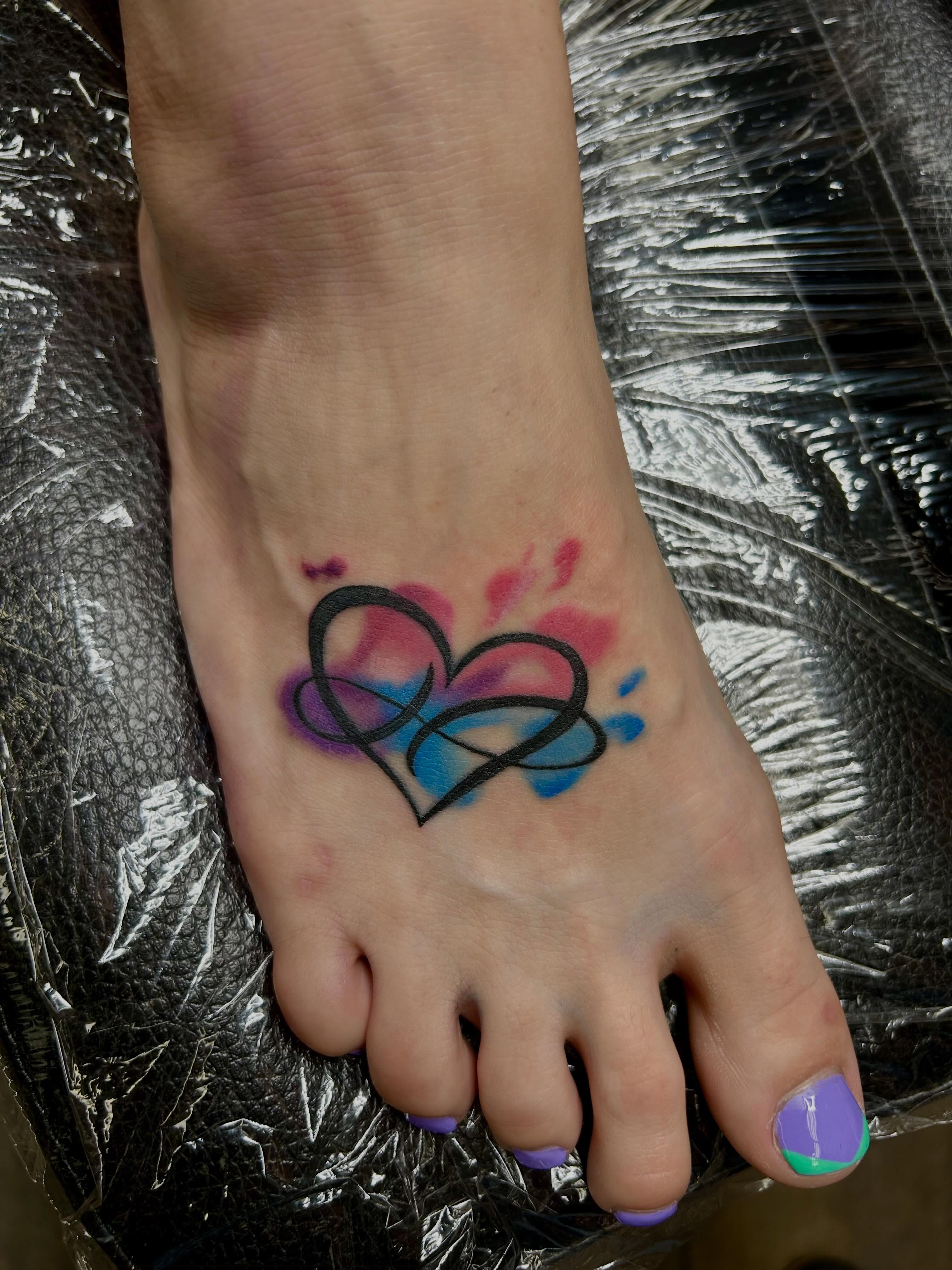 Heart geometric tattoo on the foot by Bjorn Bjornstad, Dubuque, Iowa