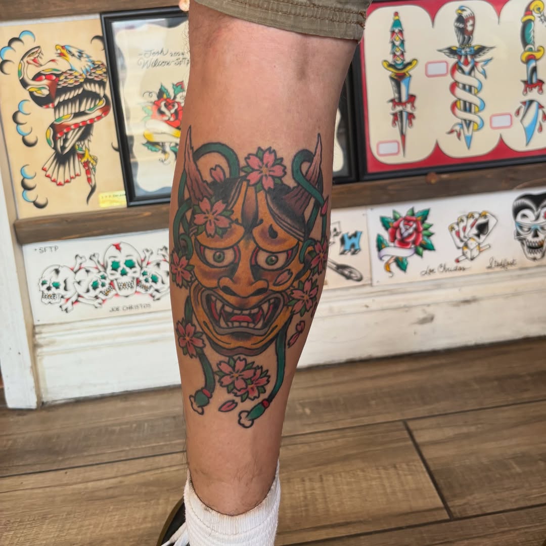 Mask with flowers American traditional tattoo on the forearm by Las Vegas Tattoo Artist