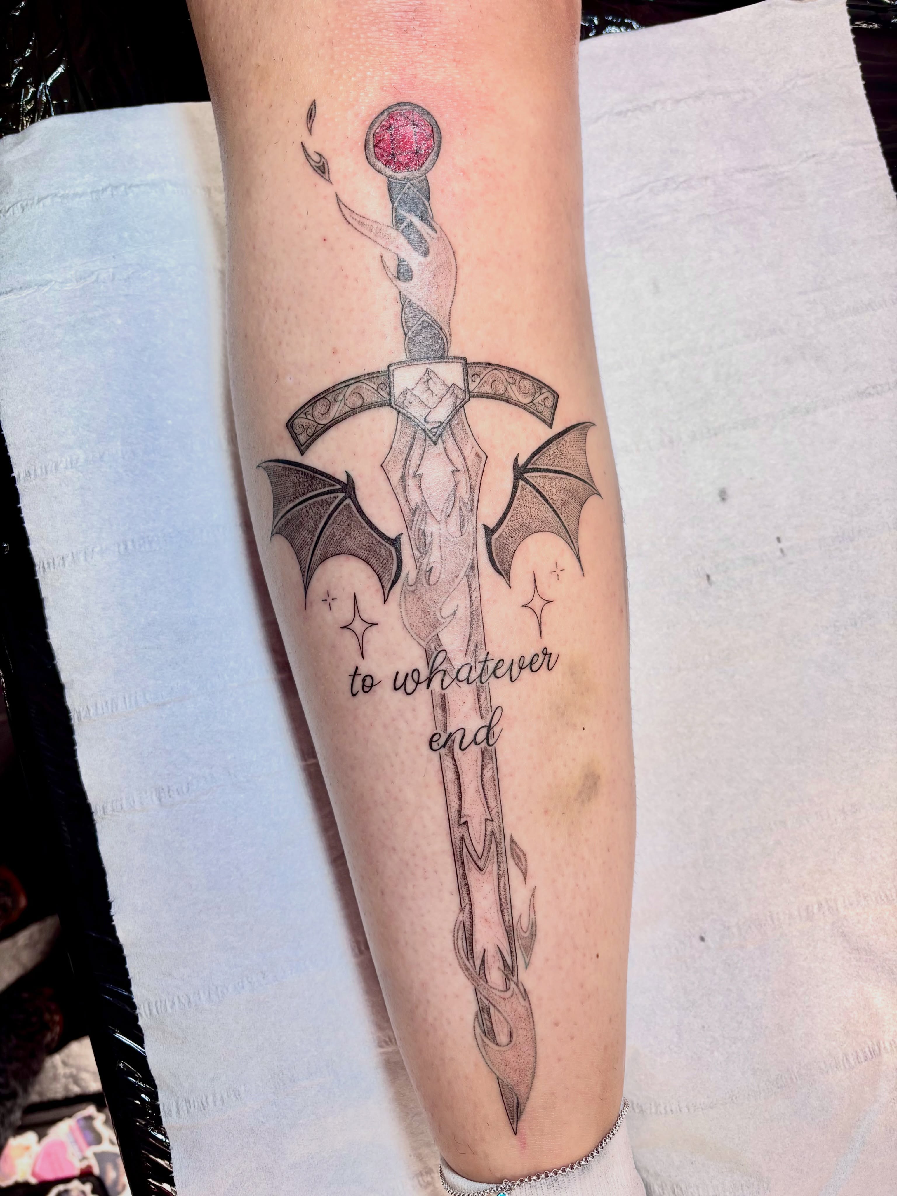 Sword and bat black and grey tattoo on the forearm by Charlotte Brown, Leeds, England
