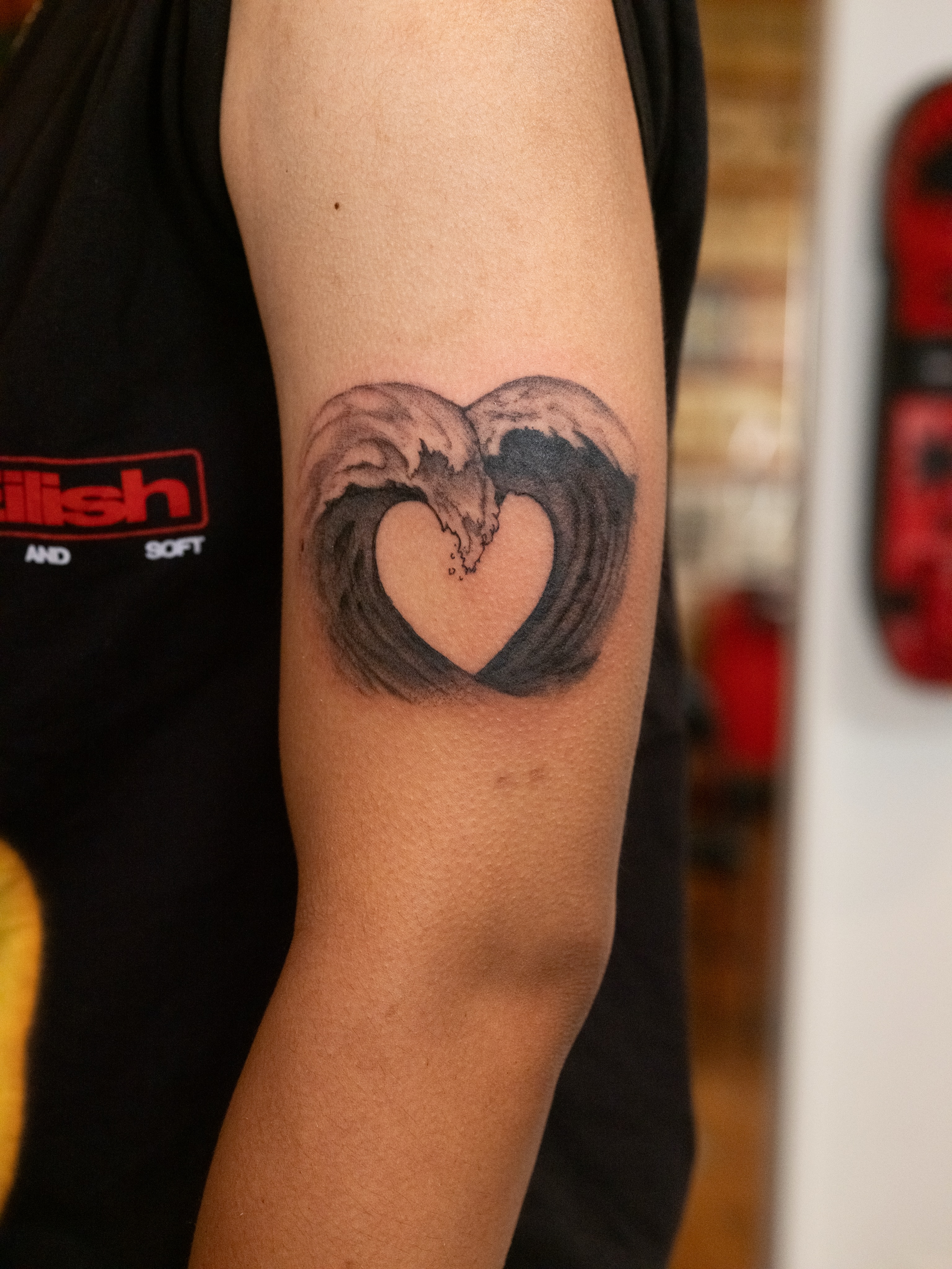 Heart with wings realism tattoo on the forearm by Dylan Coverdale