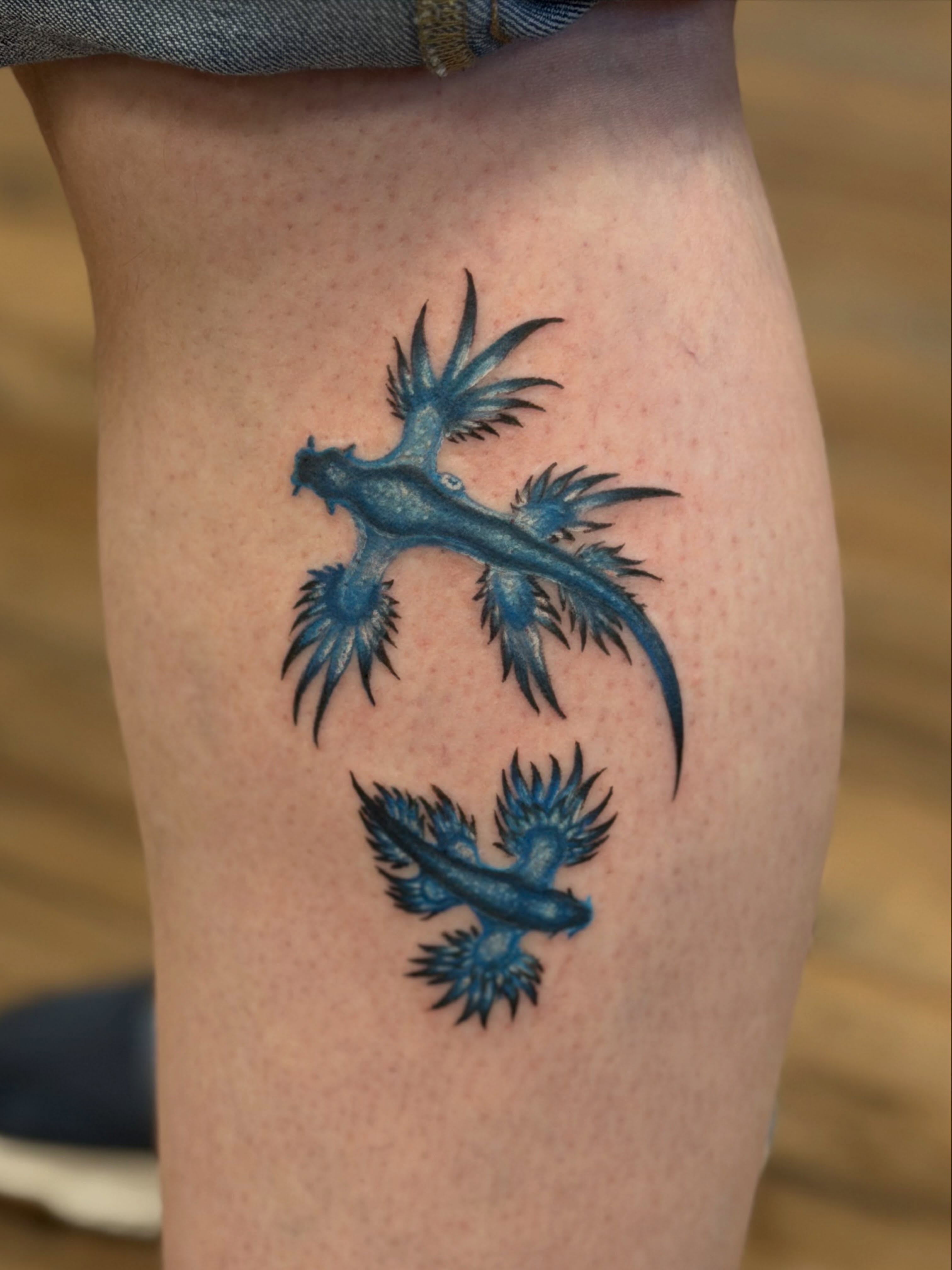 Blue dragon dotwork tattoo on the thigh by Trista Bettfreund (Birdy)