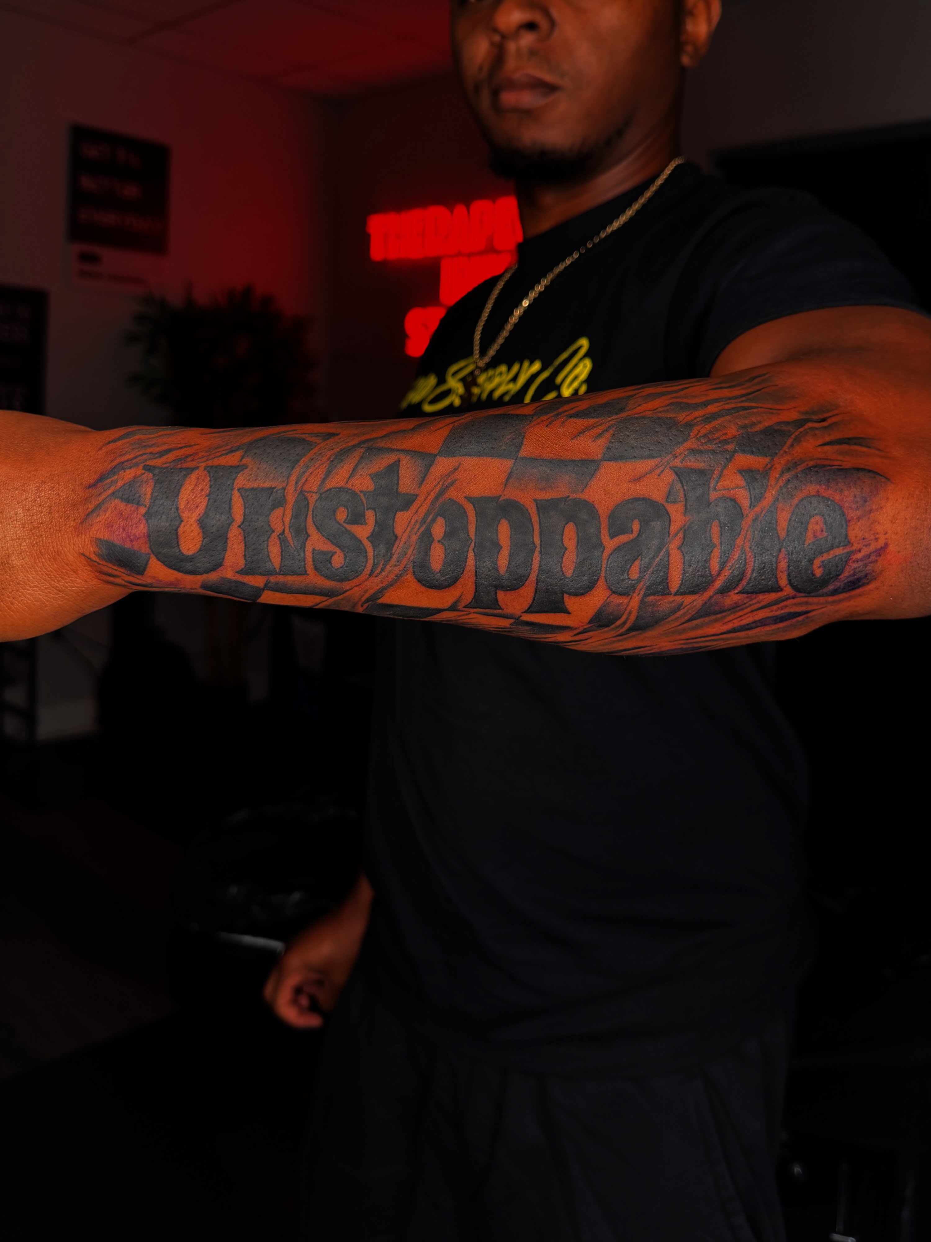 Unstoppable lettering script tattoo on the forearm by Q⚜️