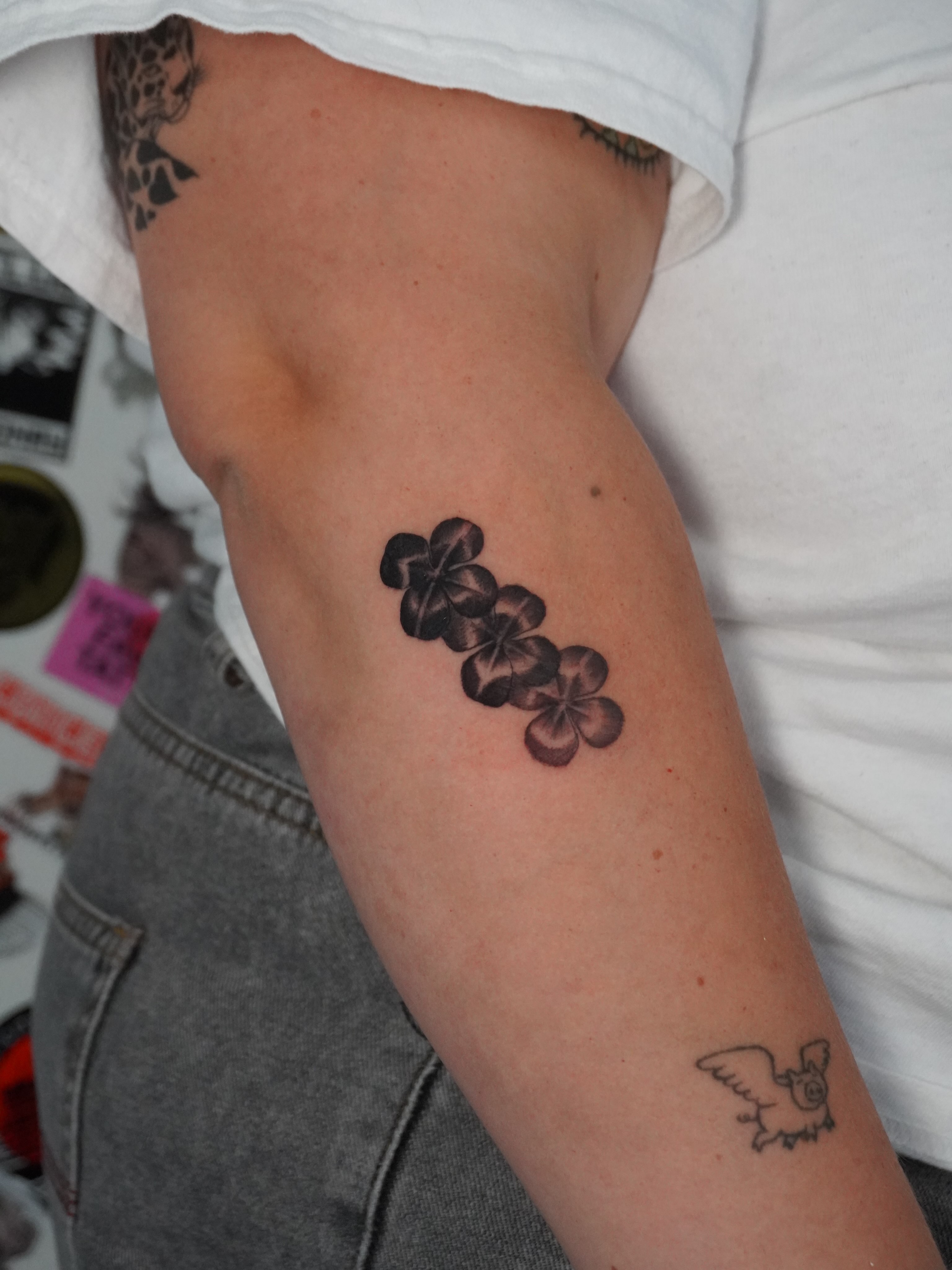 Flower cluster black and grey tattoo on the forearm by hallow ☣︎ tattoo artist, Philadelphia, Pennsylvania