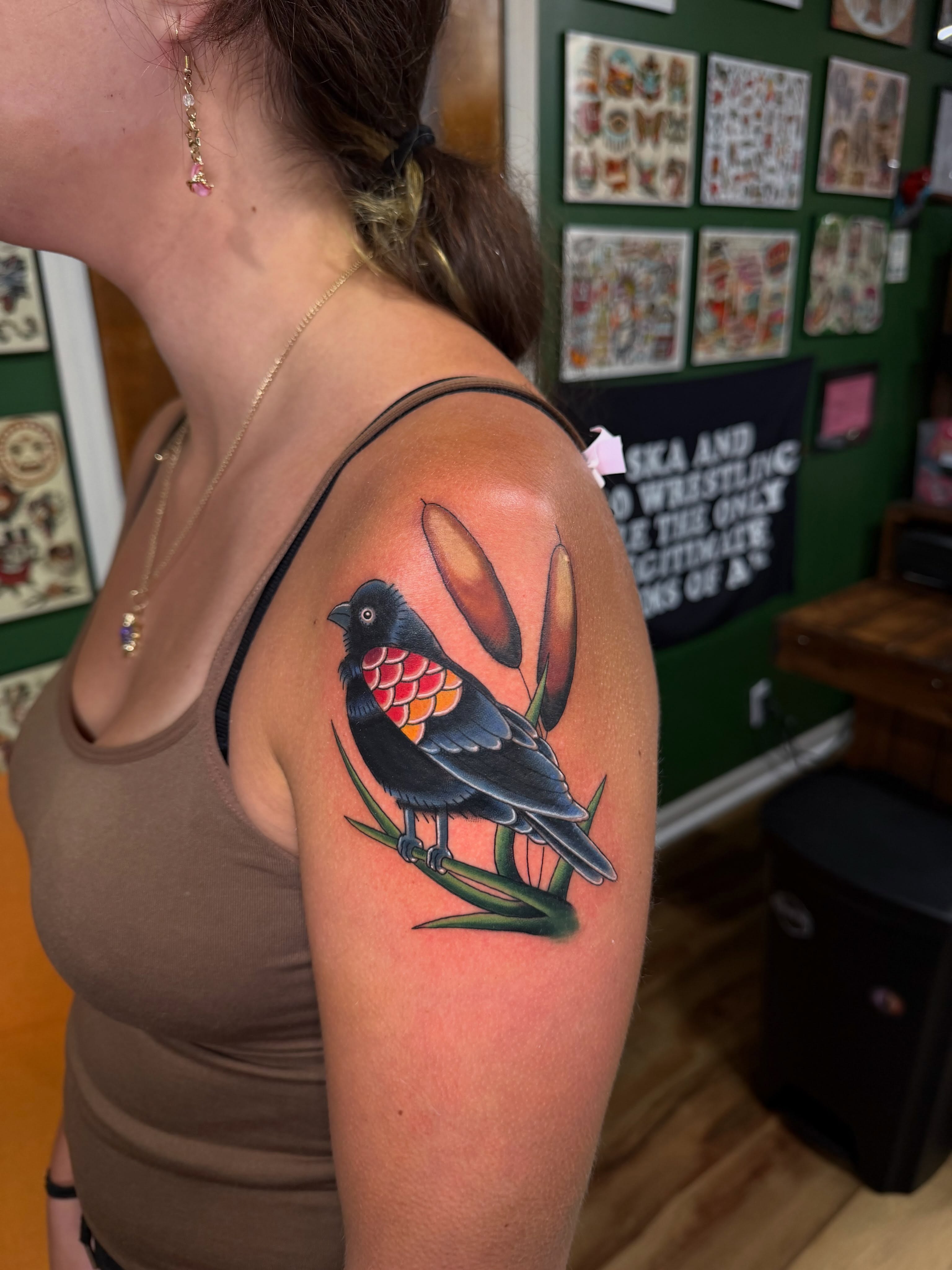 Bird American traditional tattoo on the shoulder by Dustie Pitstick