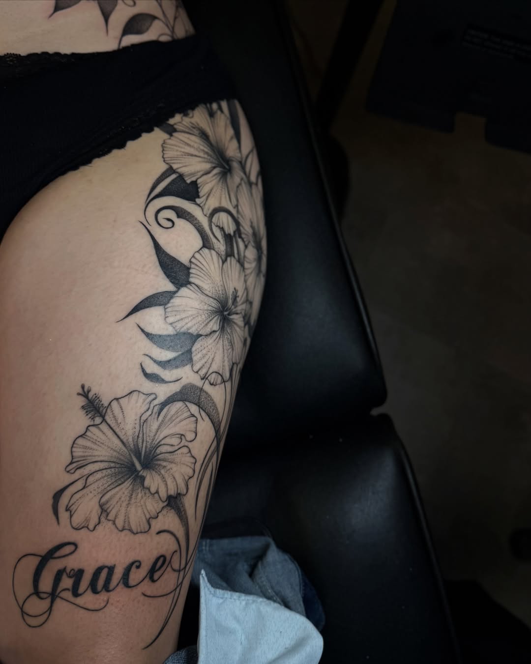 Hibiscus flowers black and grey tattoo on the thigh by Carson Mccullers ✨