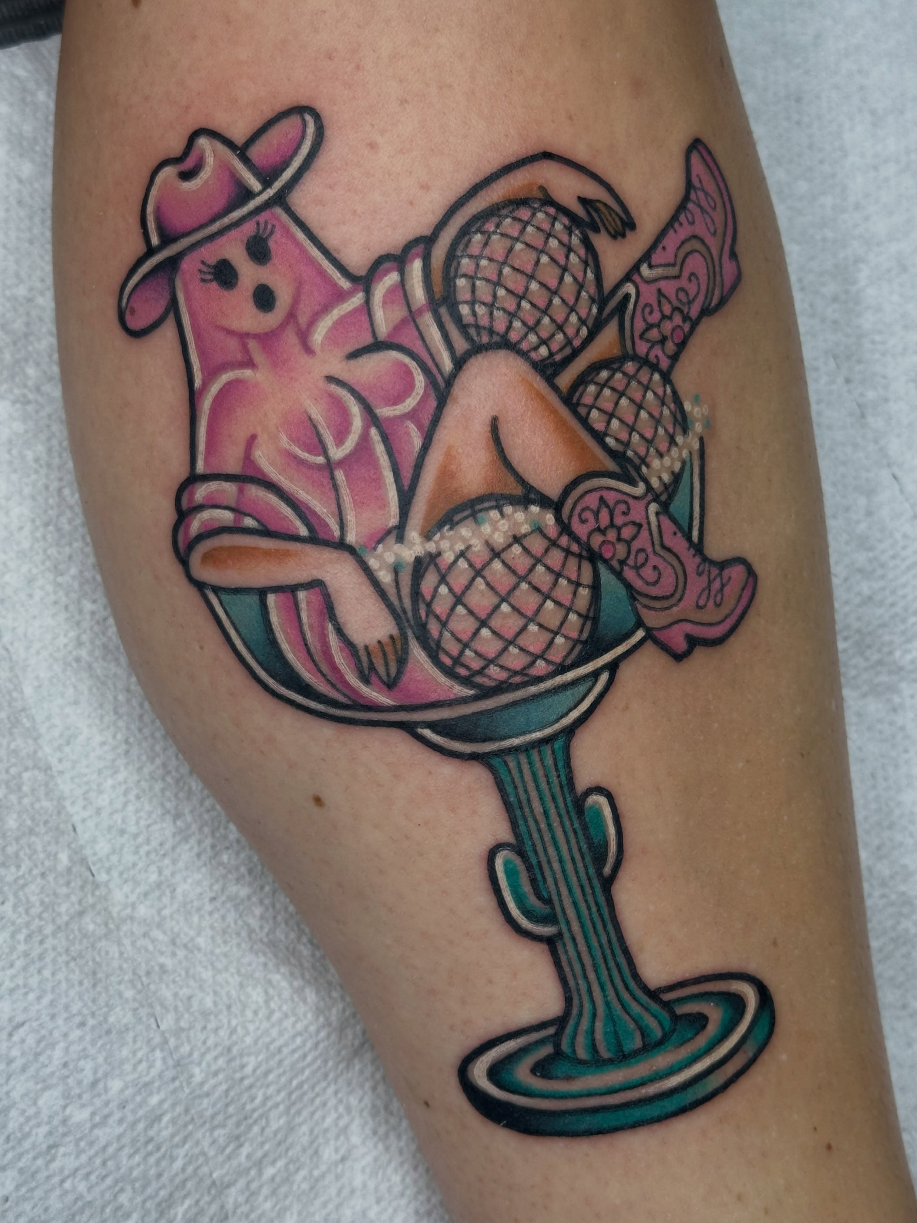 Martini glass with woman American traditional tattoo on the forearm by Ginny Marie Kalnasy
