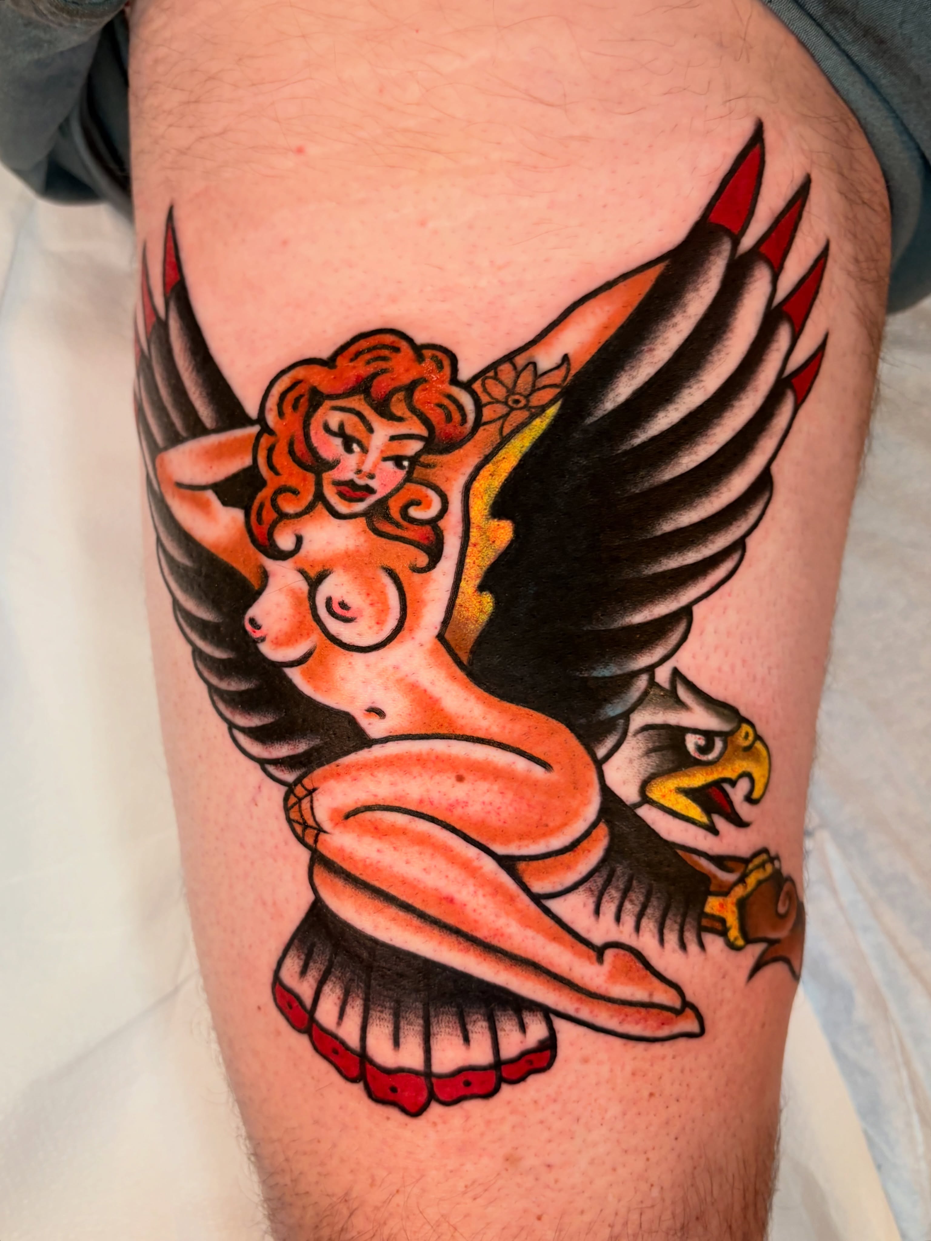 Winged woman American traditional tattoo on the thigh by ๐ต๐๐๐๐ ๐ฎ๐๐๐๐๐๐, New Orleans, Louisiana
