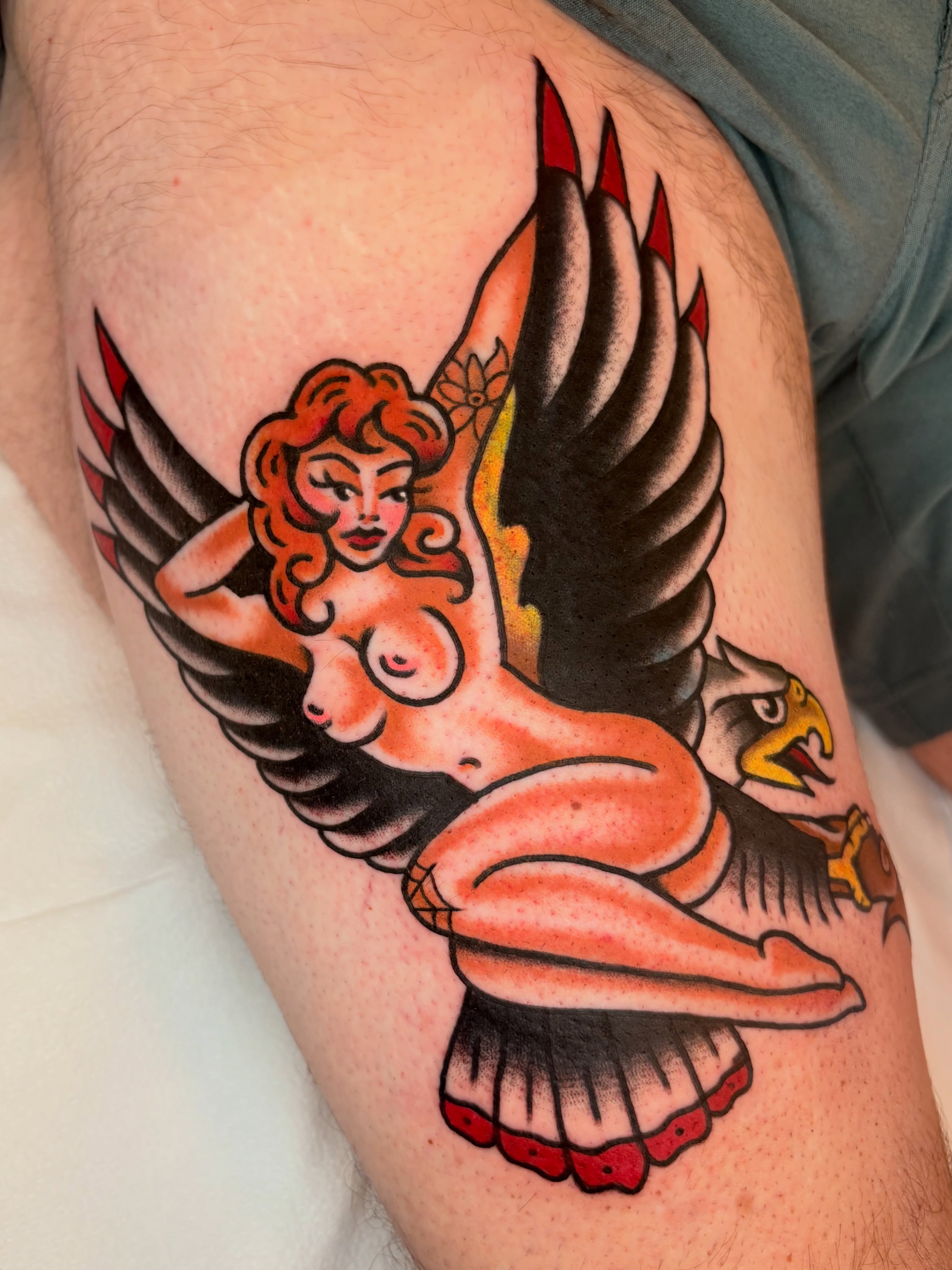 Winged woman American traditional tattoo on the thigh by ๐ต๐๐๐๐ ๐ฎ๐๐๐๐๐๐, New Orleans, Louisiana