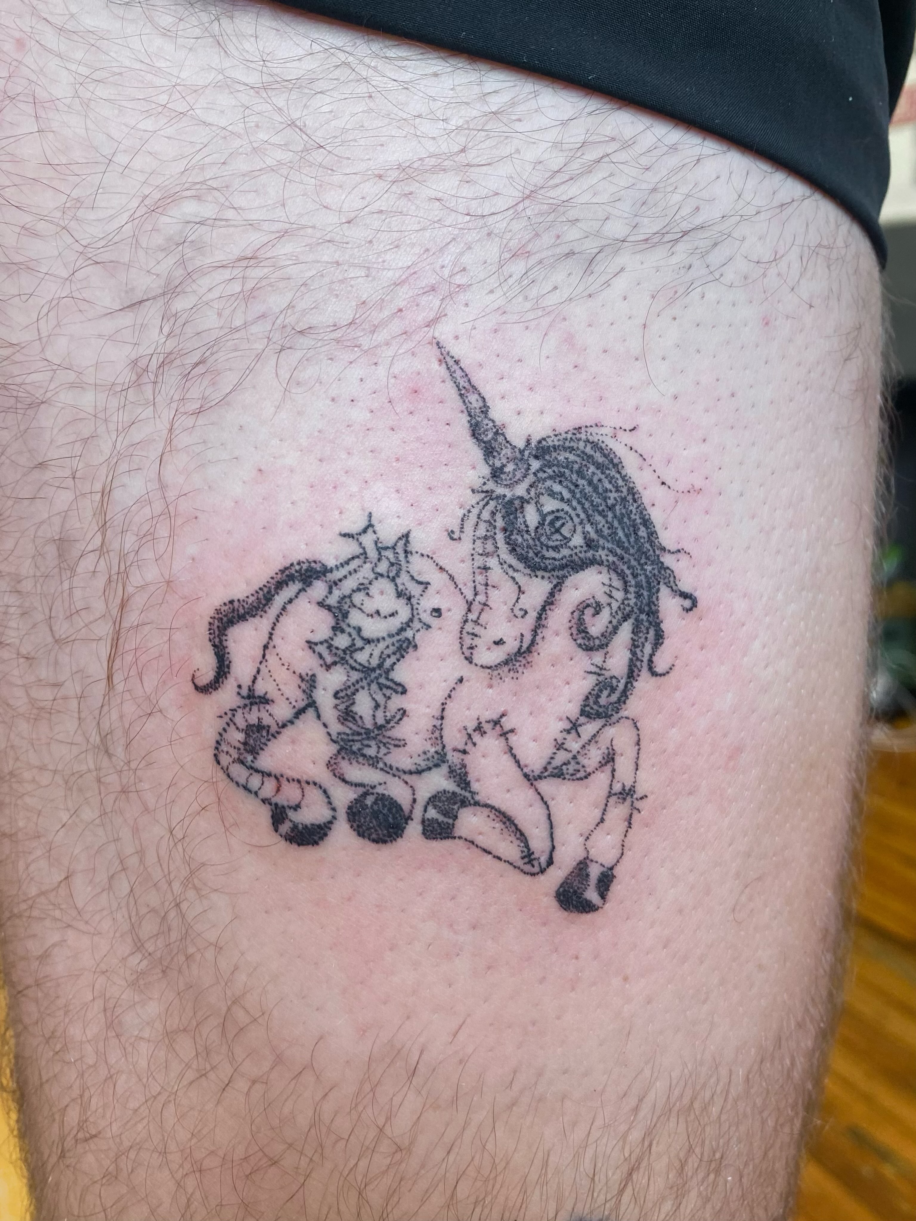 Unicorn and flowers black and grey tattoo on the thigh by @feverfeverish