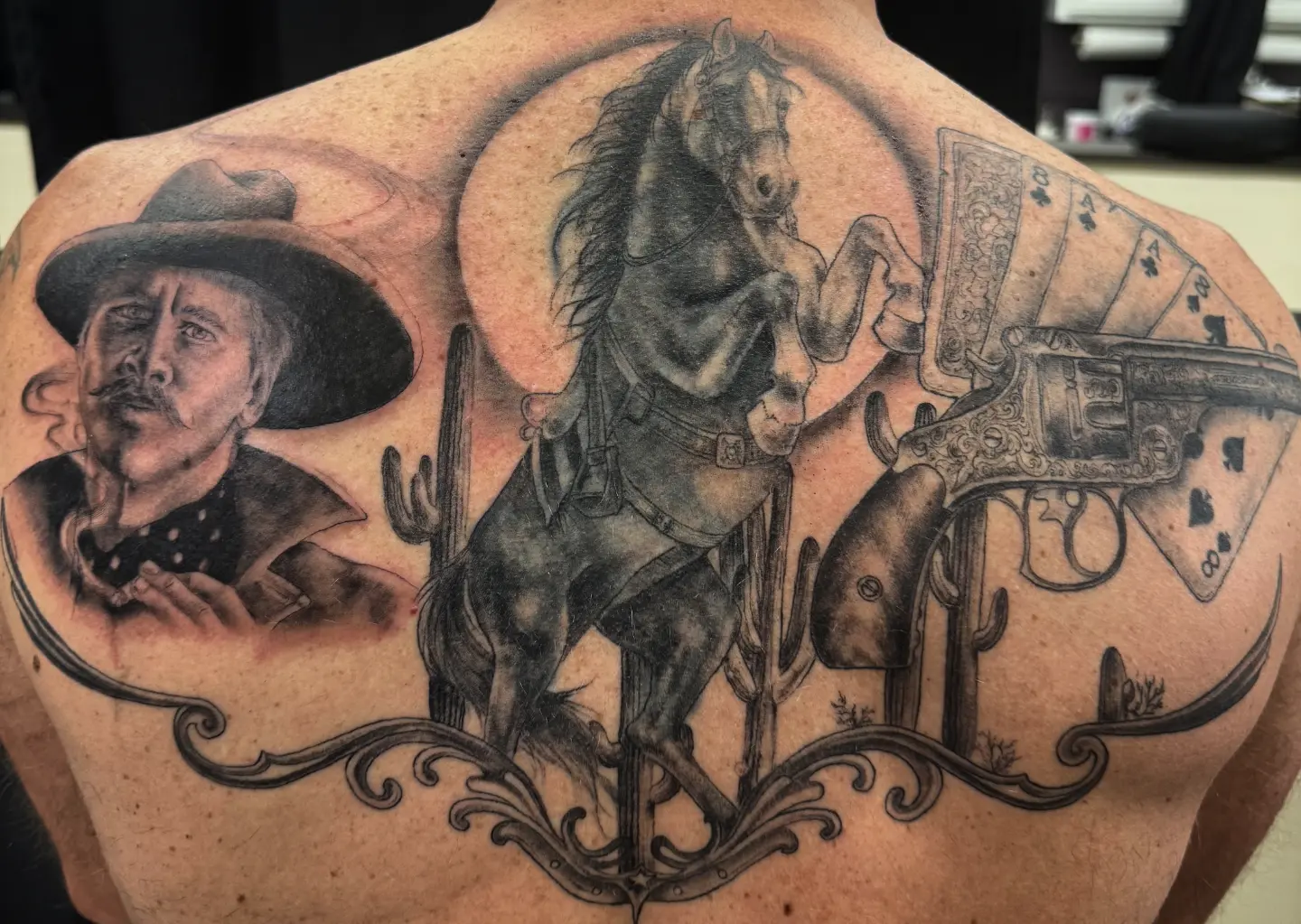 Cowboy and horse realism tattoo on the back by Katherine