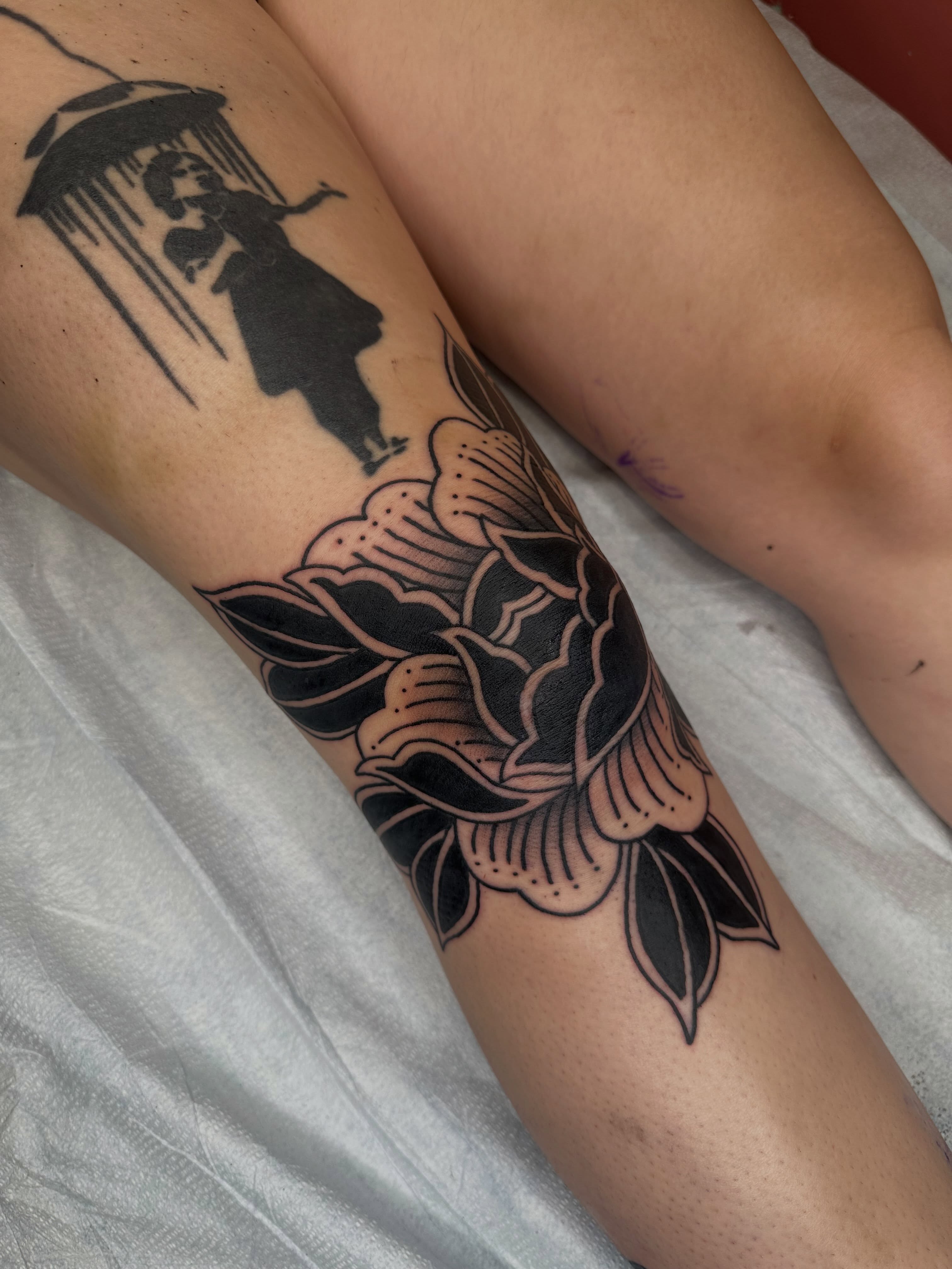 Flower black and grey tattoo on the forearm by Alex Gunshefski