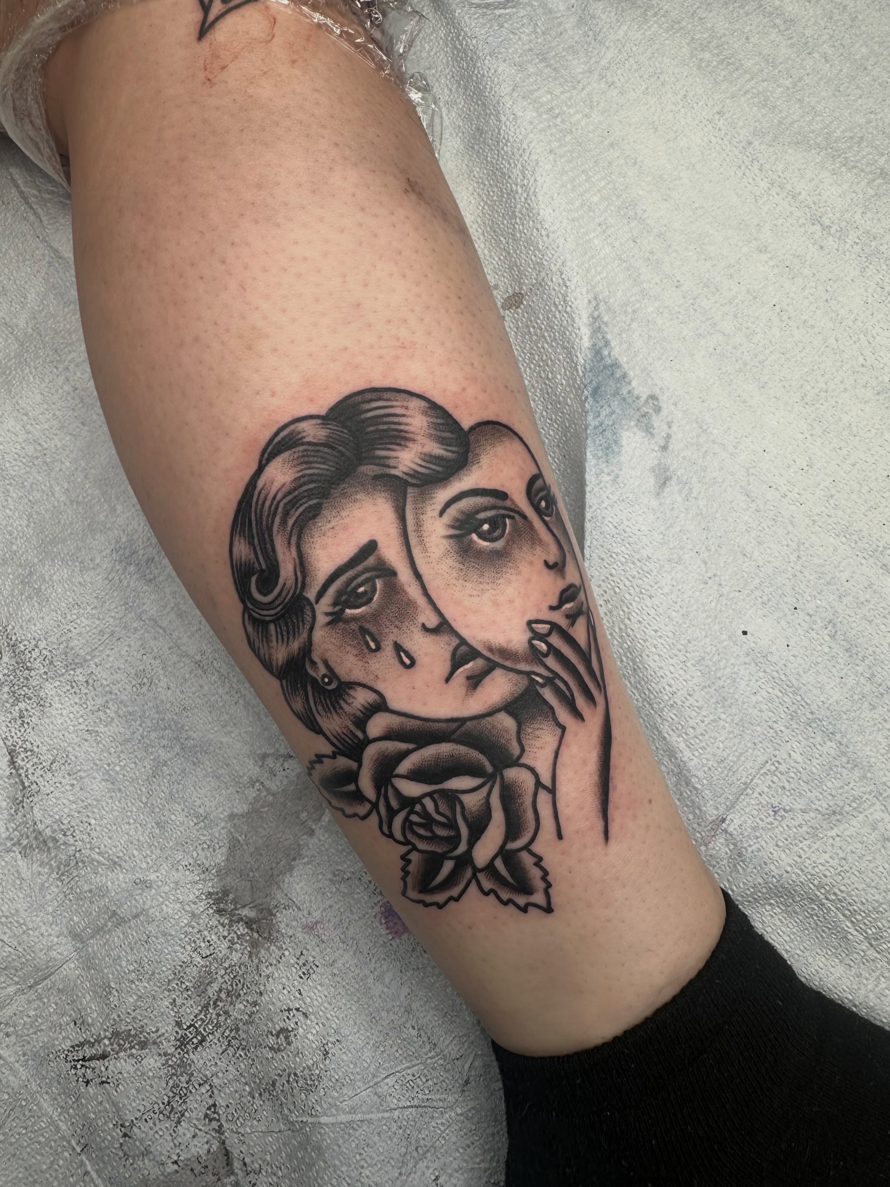 Woman with roses American traditional tattoo on the forearm by Alex Gunshefski