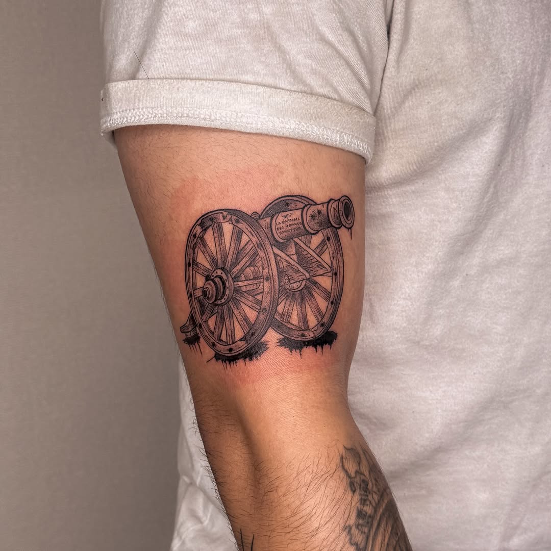 Cannon black and grey tattoo on the forearm by Las Vegas Tattoo Artist