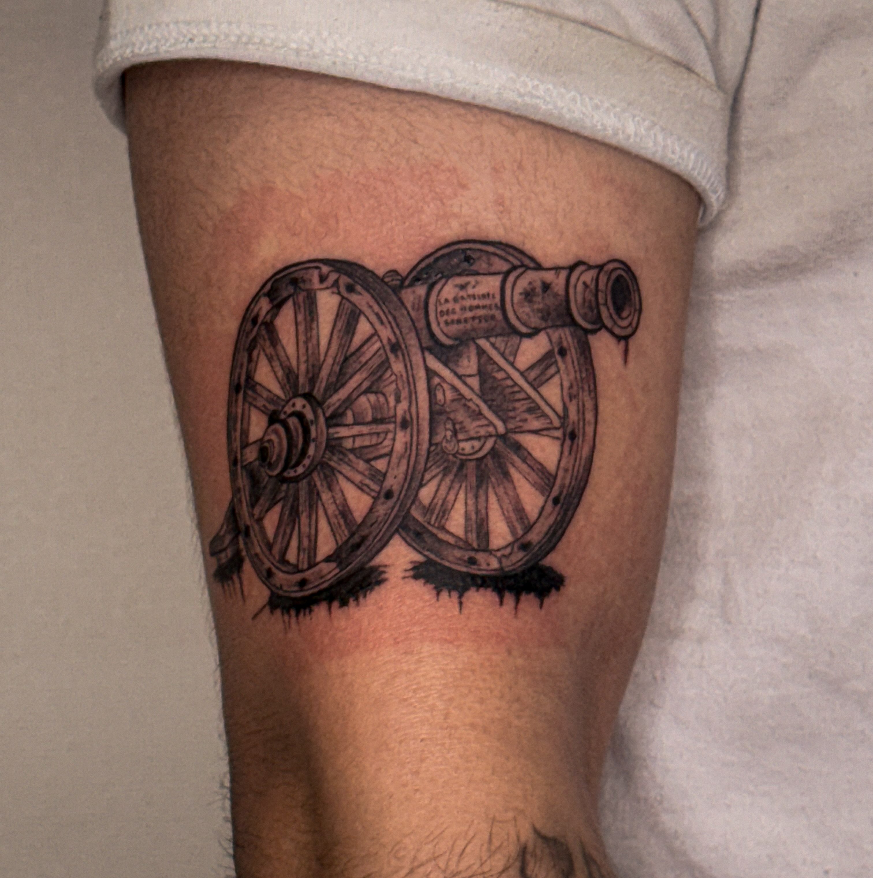 Cannon black and grey tattoo on the forearm by Las Vegas Tattoo Artist
