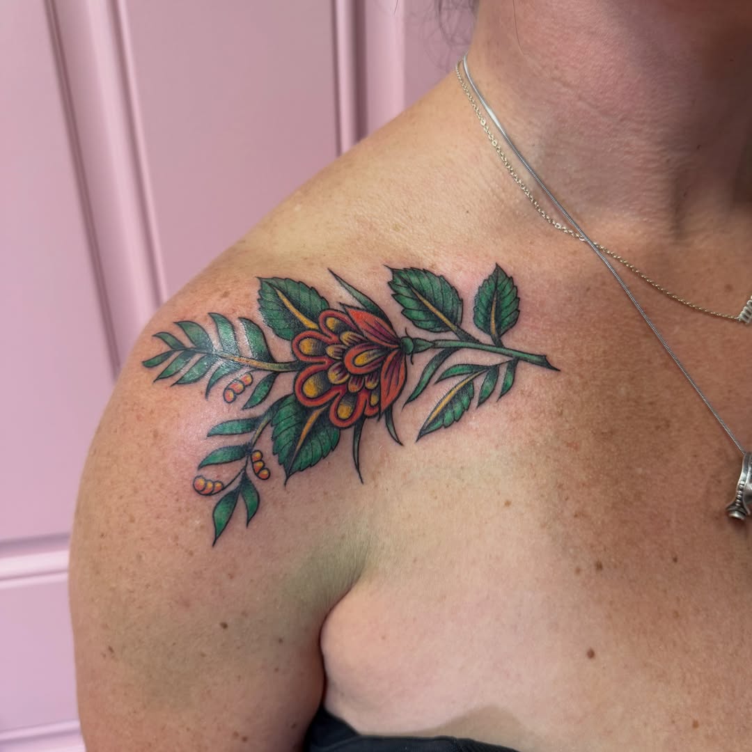 Flower American traditional tattoo on the shoulder by Jennylee Aerts, Asbury Park, New Jersey