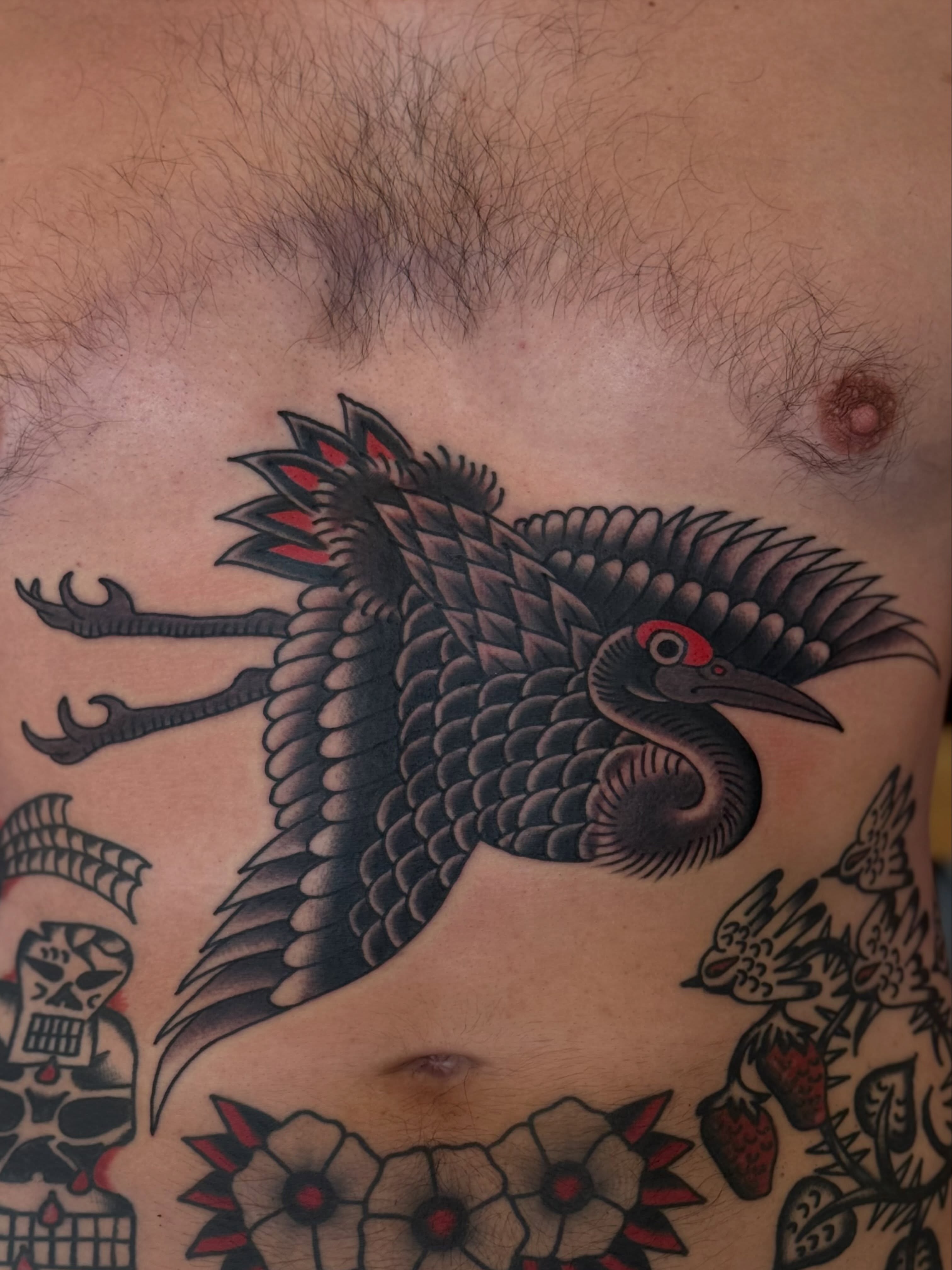 Bird American traditional tattoo on the chest by San Diego tattoo artist