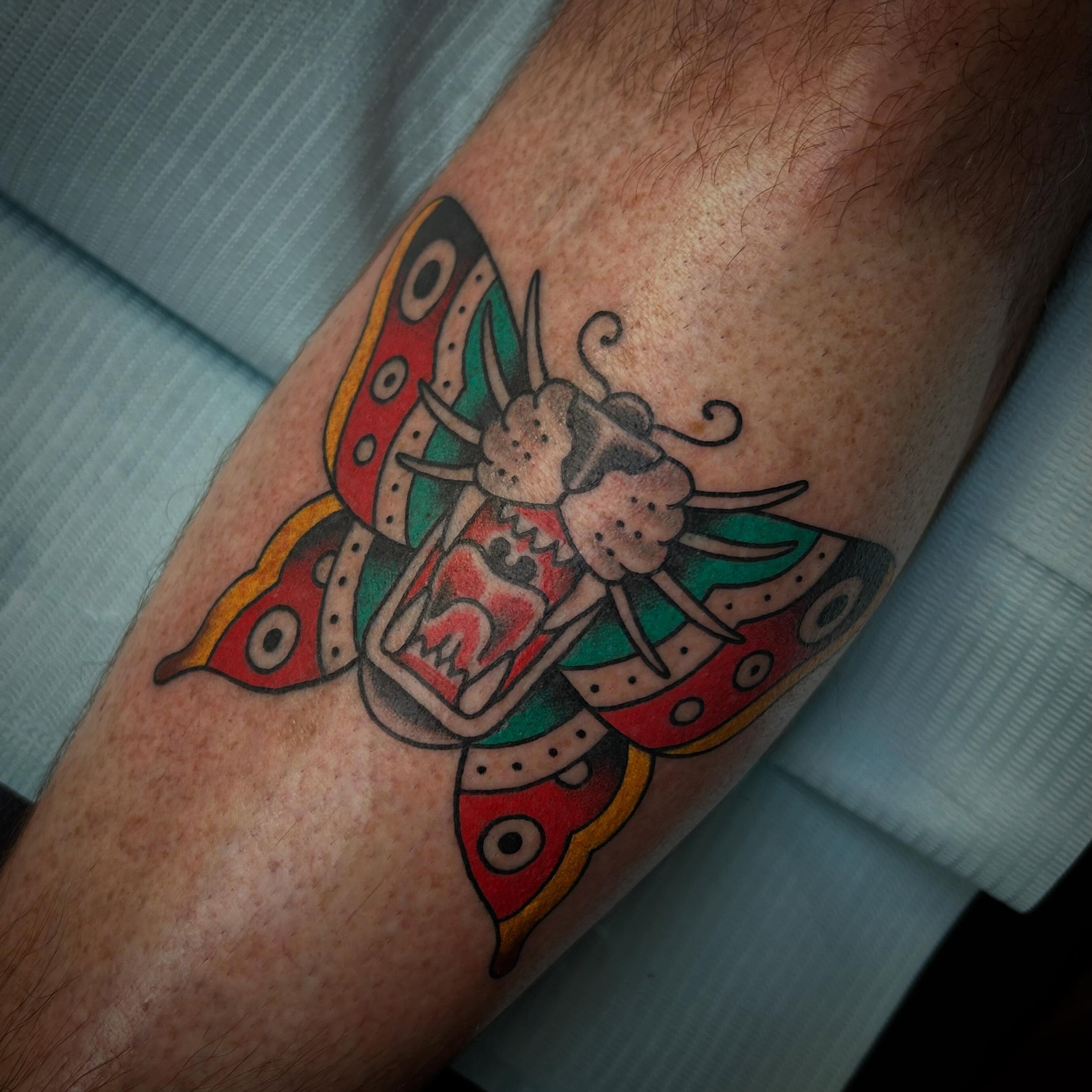 Butterfly American traditional tattoo on the forearm by Blake Chambers