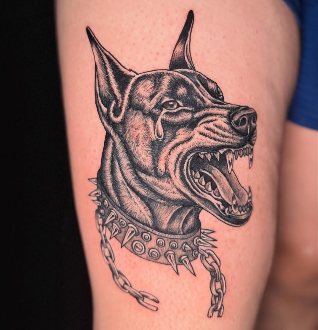 Doberman realism tattoo on the thigh by Lord Daniel Serna