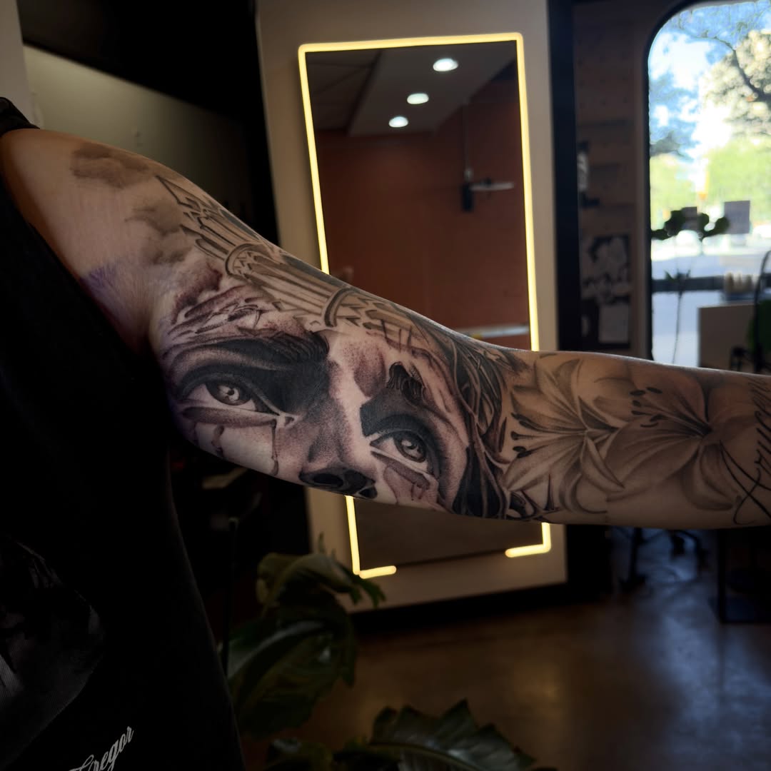 Woman's face realism tattoo on the forearm by Joe Cruz