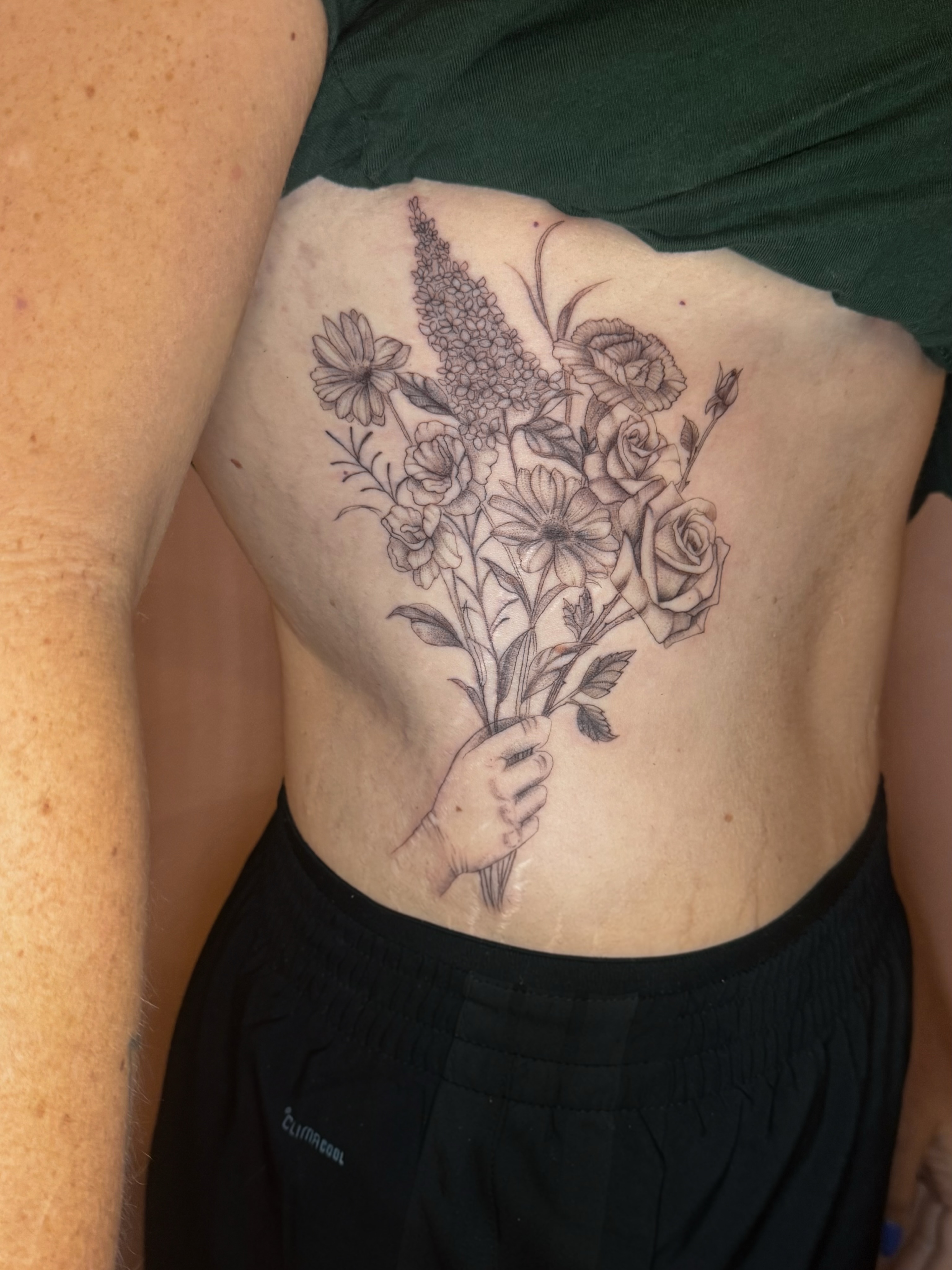 Flower bouquet black and grey tattoo on the ribs by fine line tattoo artist▪️Austin TX