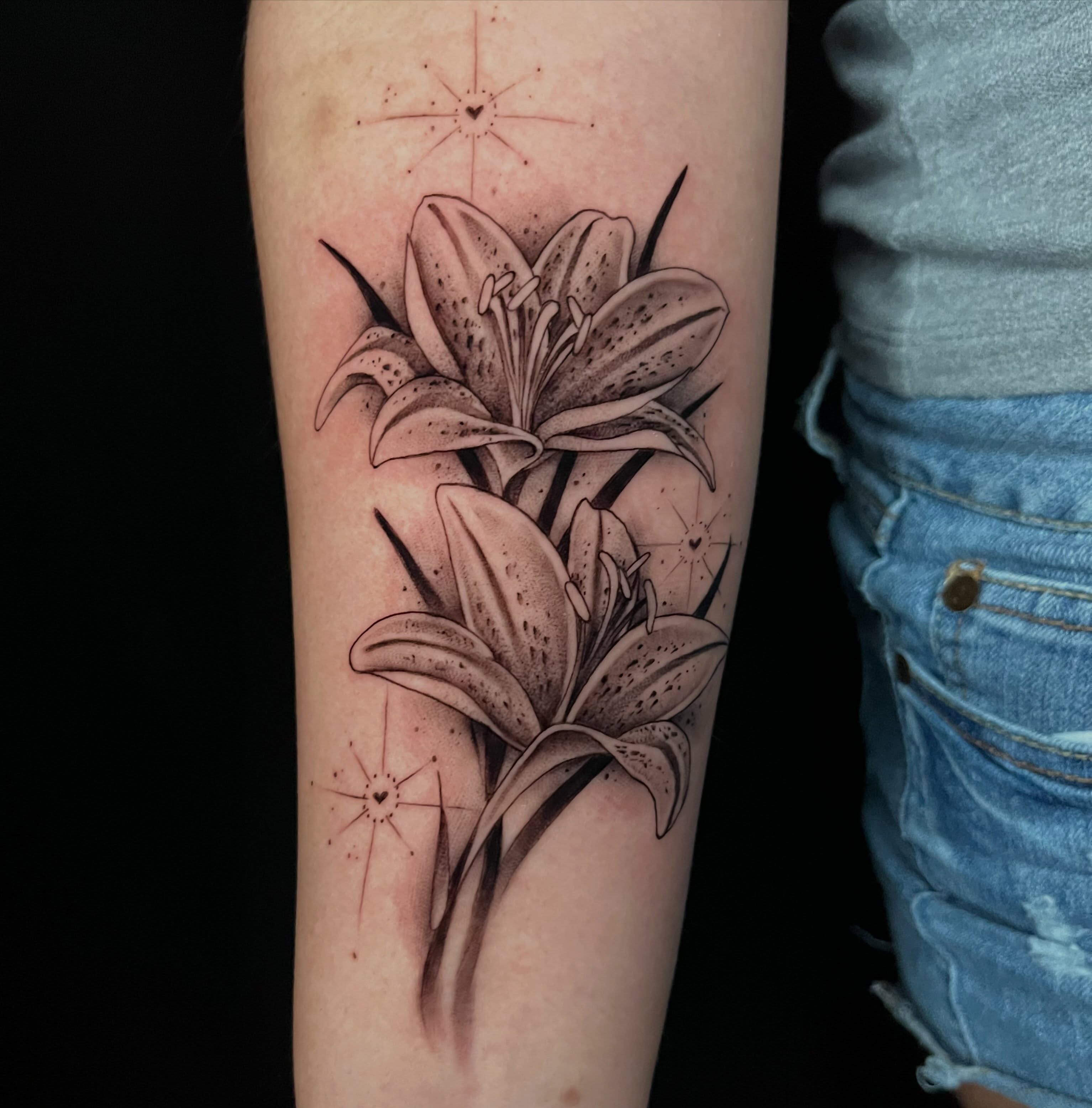 Lilies realism tattoo on the forearm by Cuda
