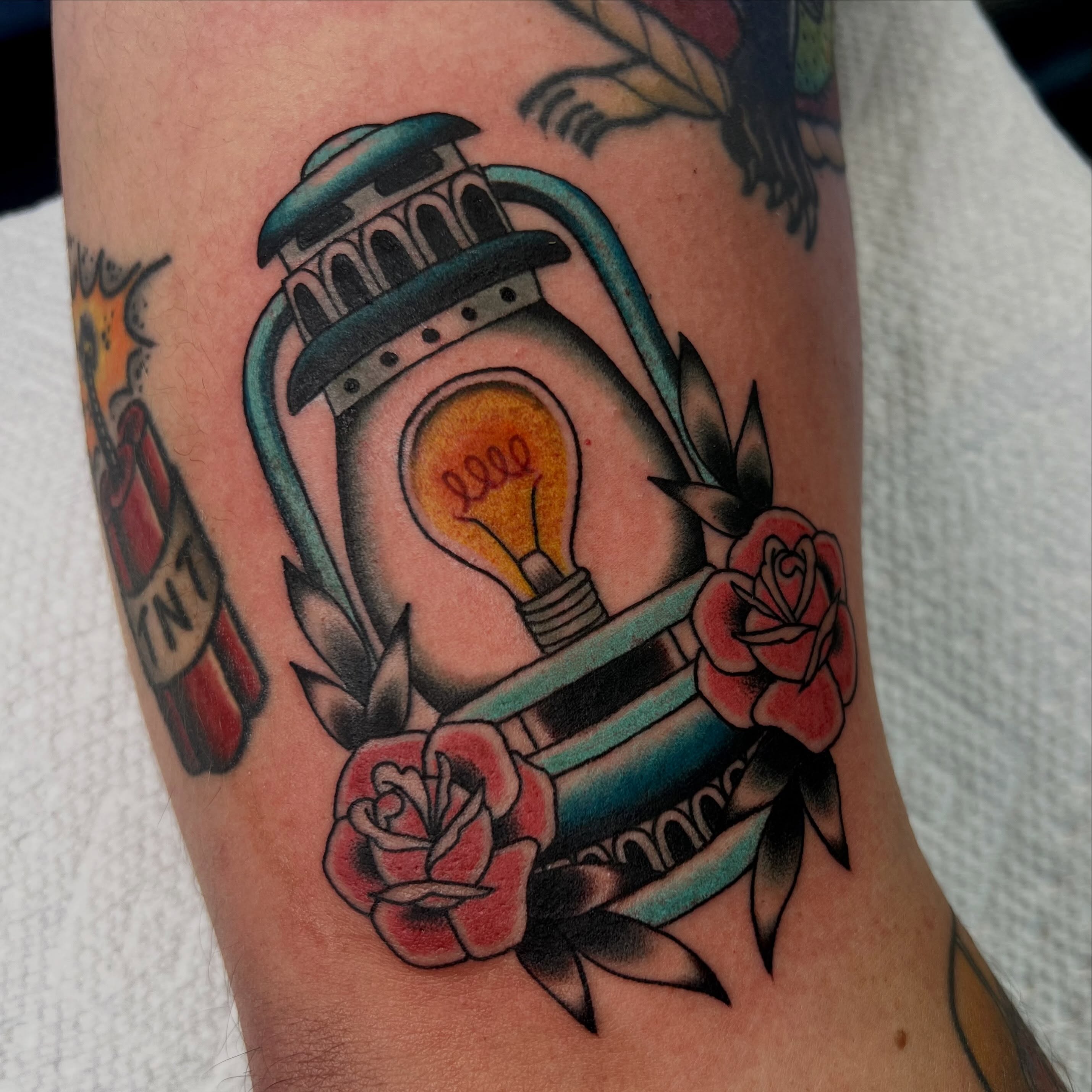 Lantern and roses American traditional tattoo on the forearm by Kahlan ⍟