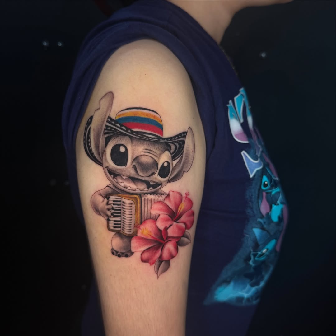 Stitch playing accordion new school tattoo on the forearm by Angela Azure
