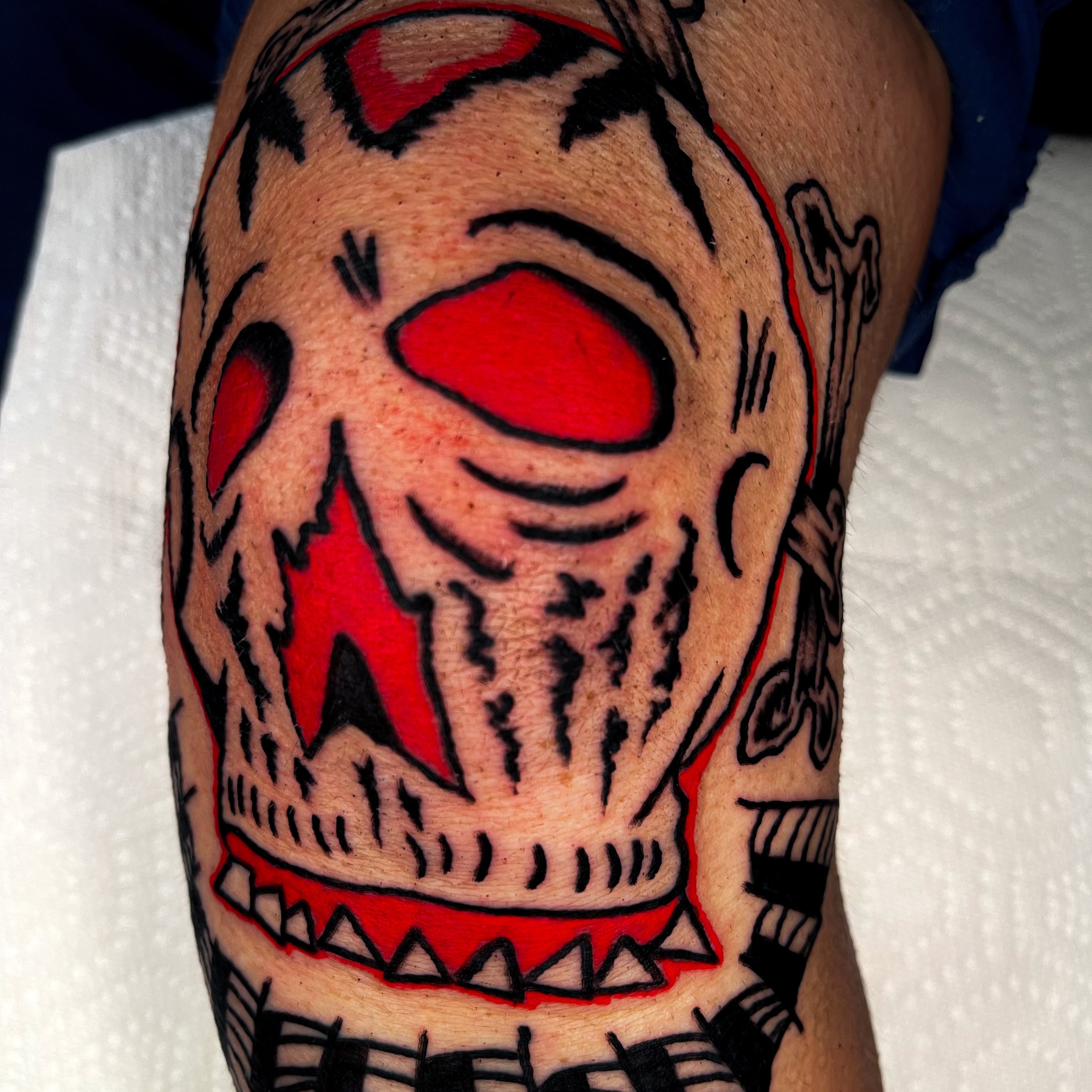 Clown face American traditional tattoo on the forearm by Devyn Hightower