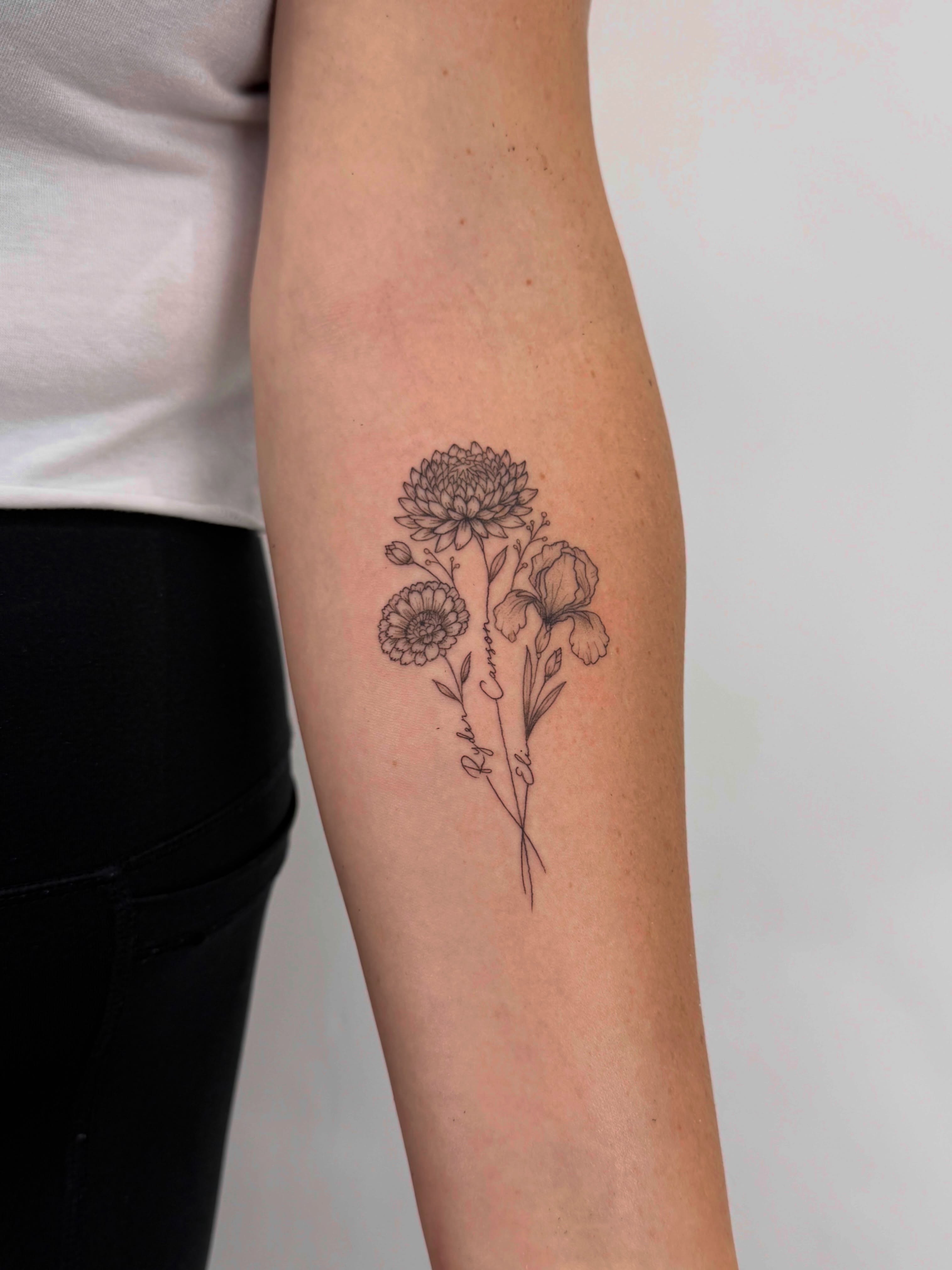 Flower bouquet black and grey tattoo on the forearm by Alex