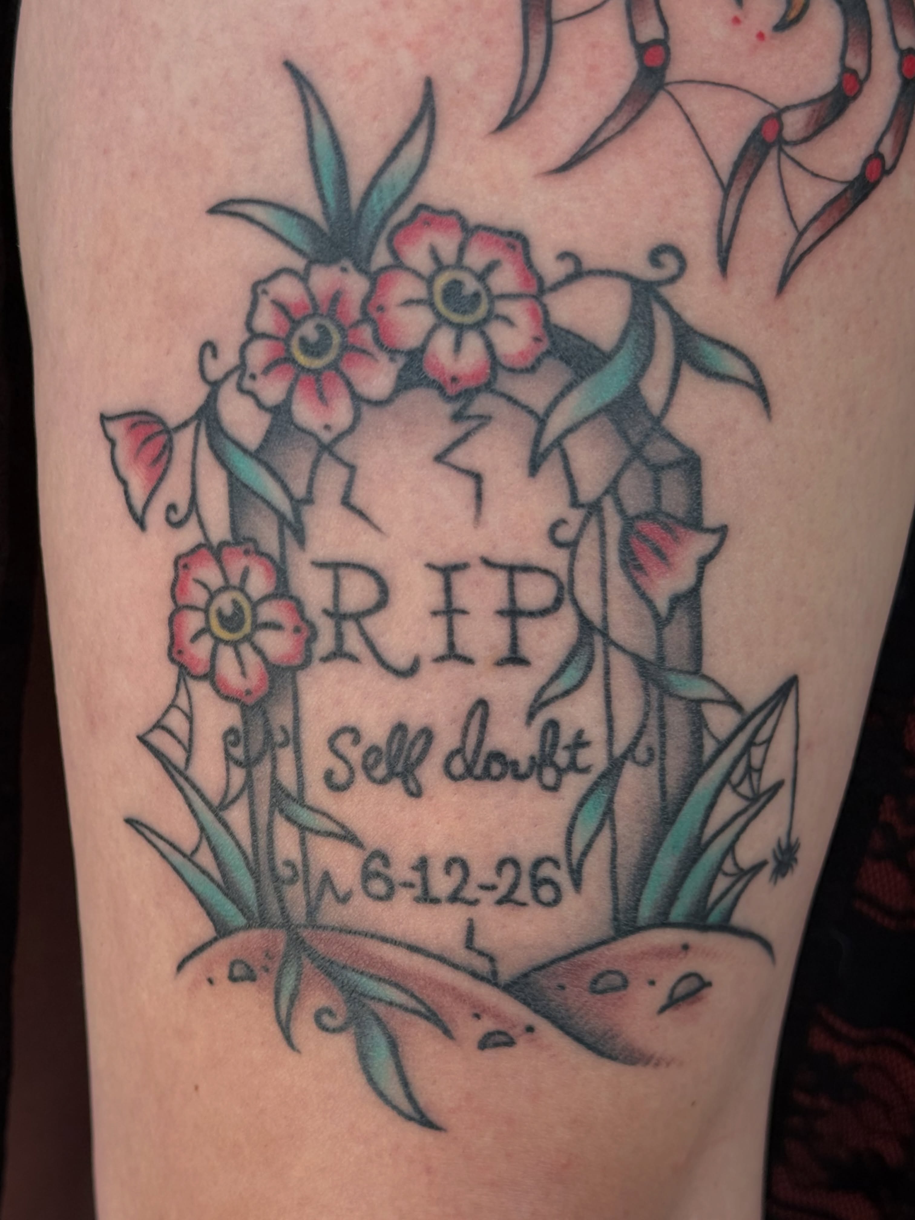 Grave marker with flowers American traditional tattoo on the thigh by Kaysen