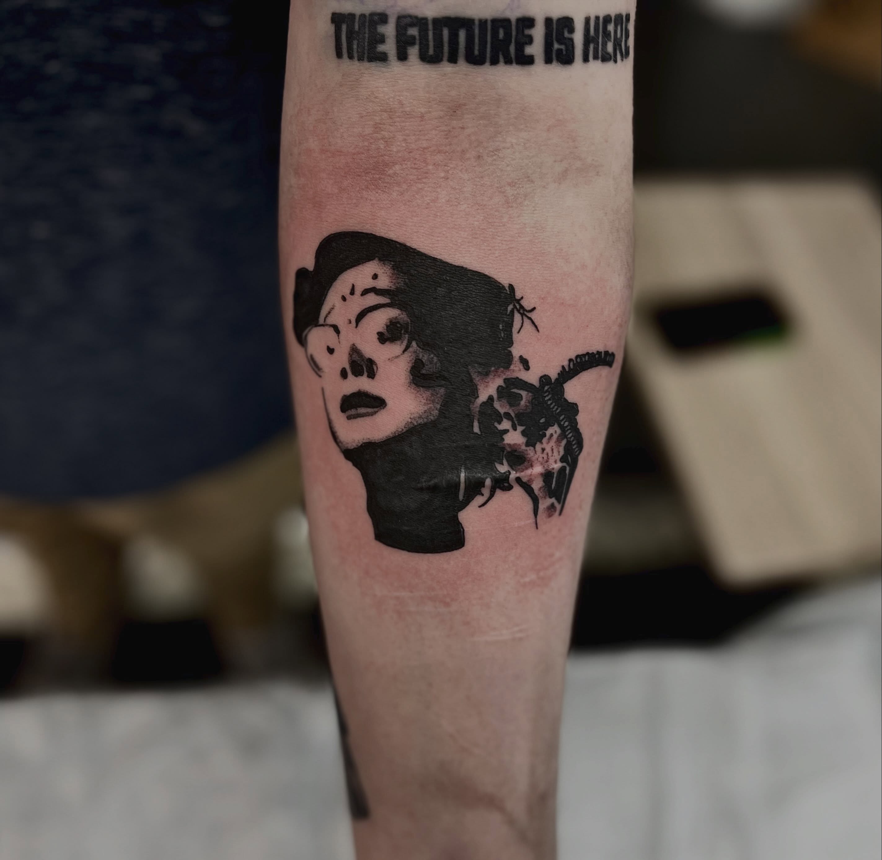 Skull black and grey tattoo on the forearm by Mason McCubbin