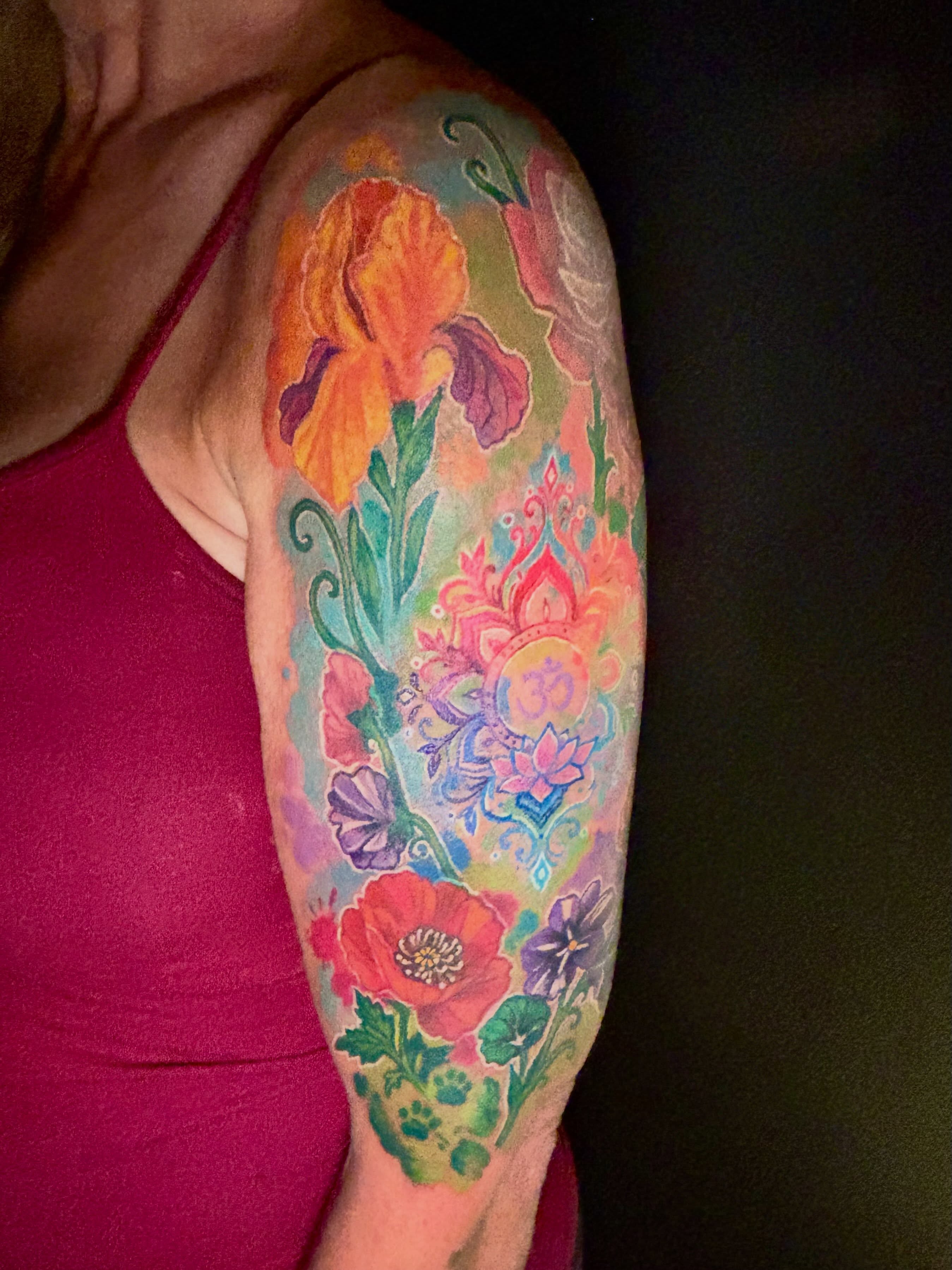 Floral bouquet new school tattoo on the upper arm by Taylor Tha Color Queen