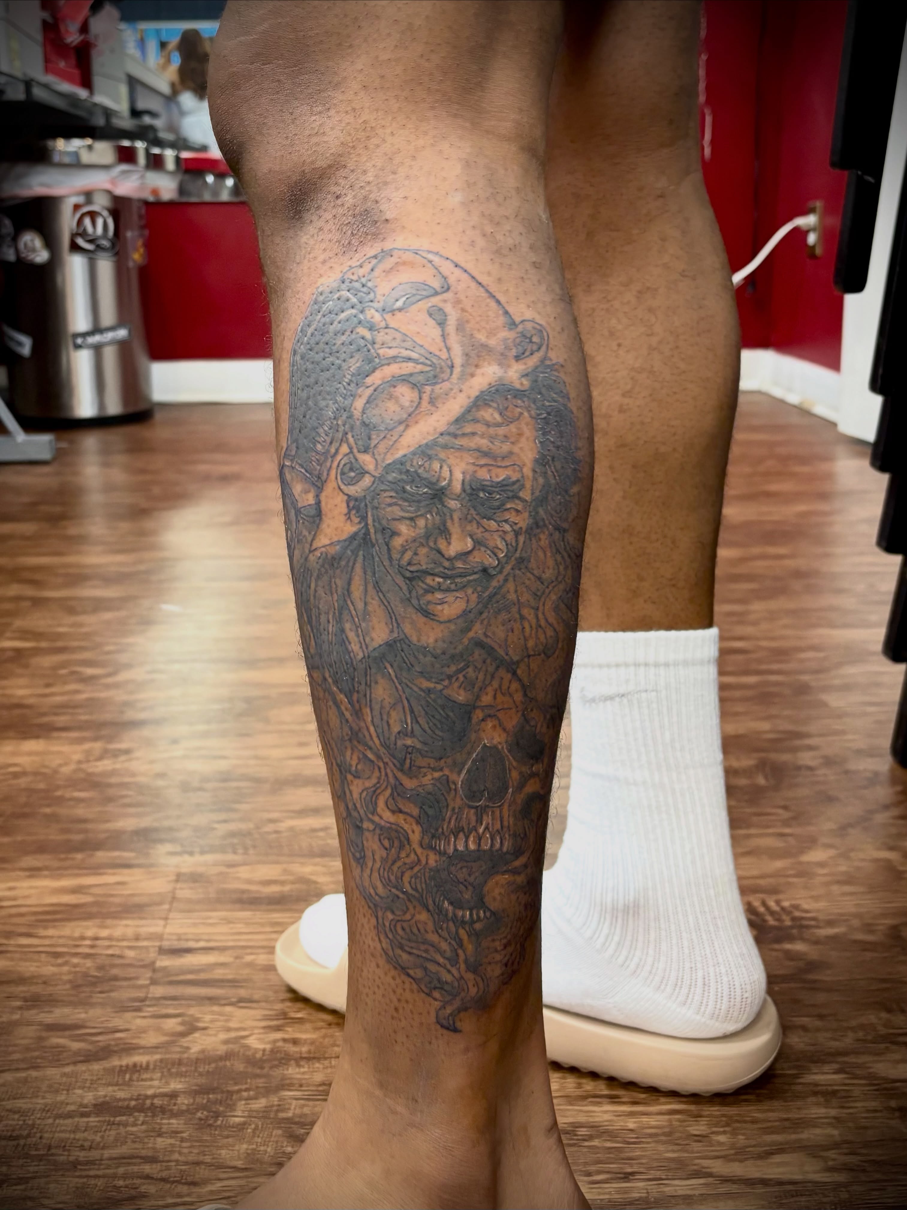 Pirate skull realism tattoo on the calf by Thom Johns-Green