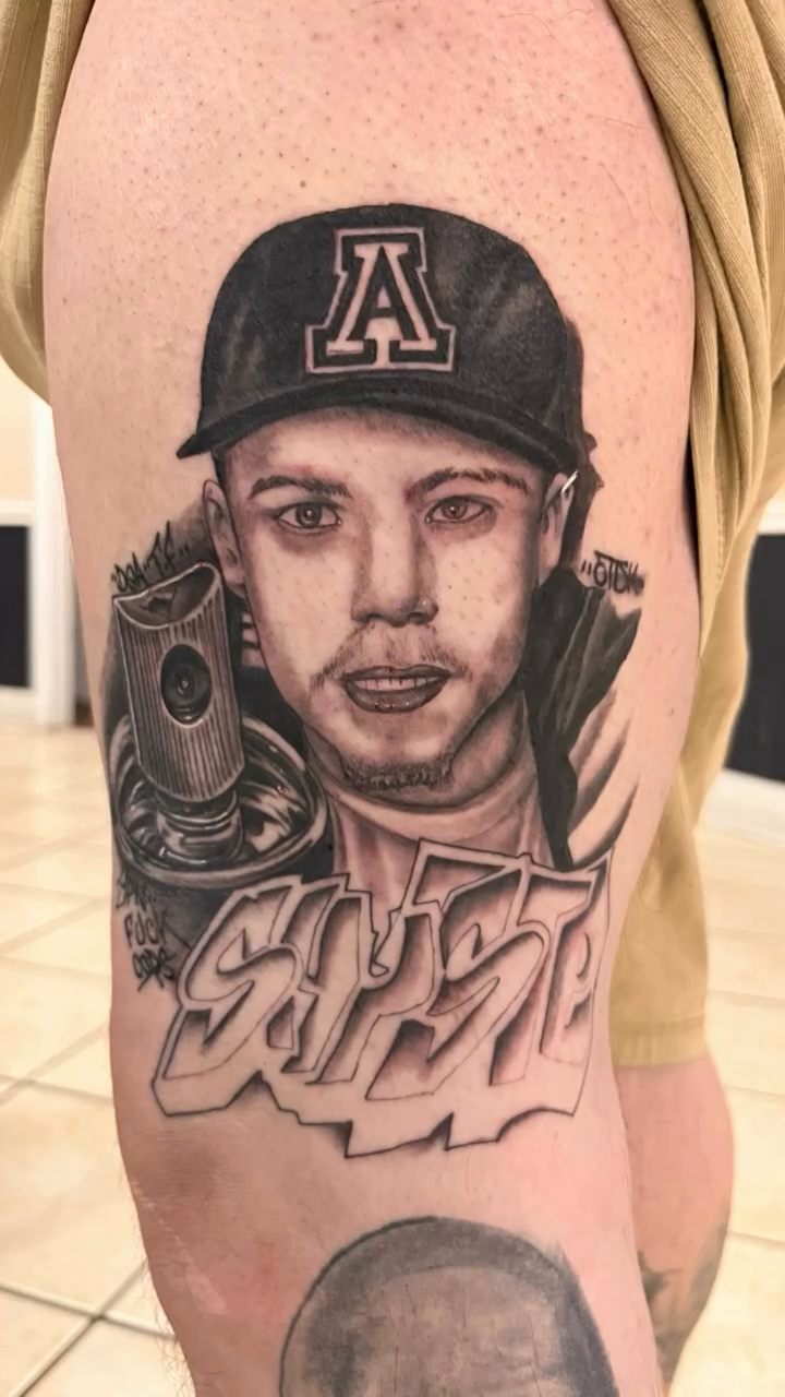 Man and graffiti lettering realism tattoo by Look