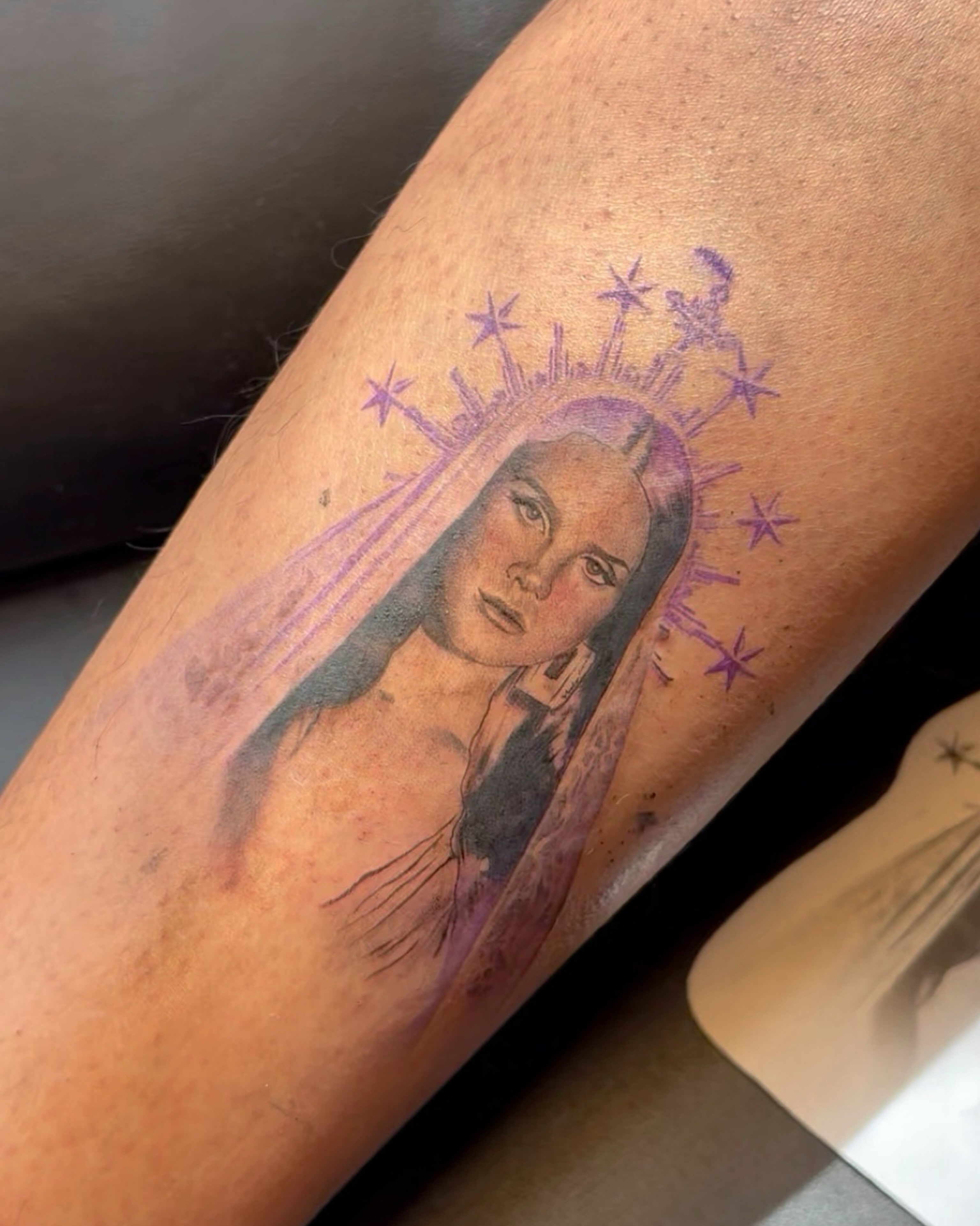 Woman with stars realism tattoo on the forearm by Gabriel