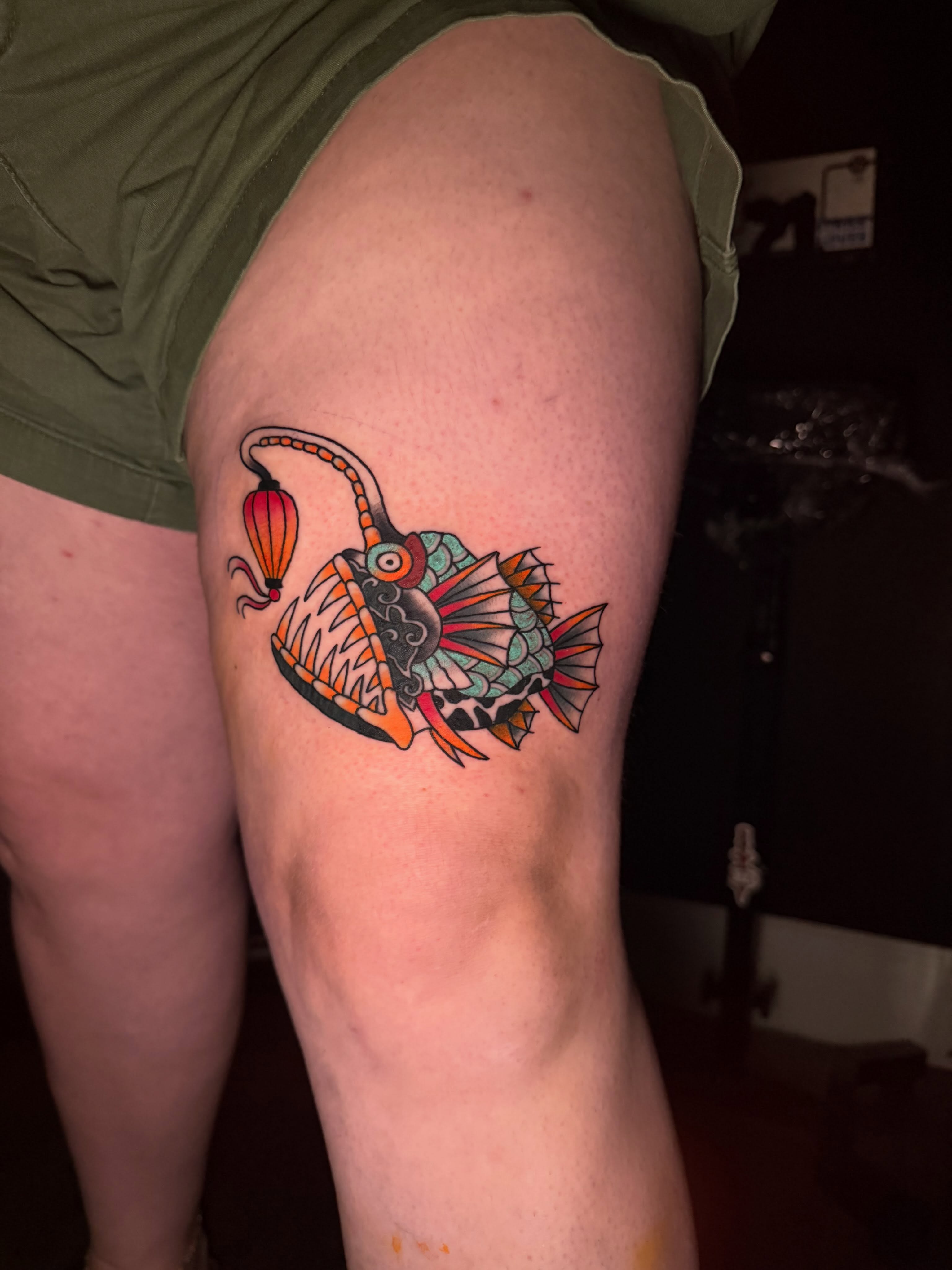Fish American traditional tattoo on the thigh by Delaney Cooper