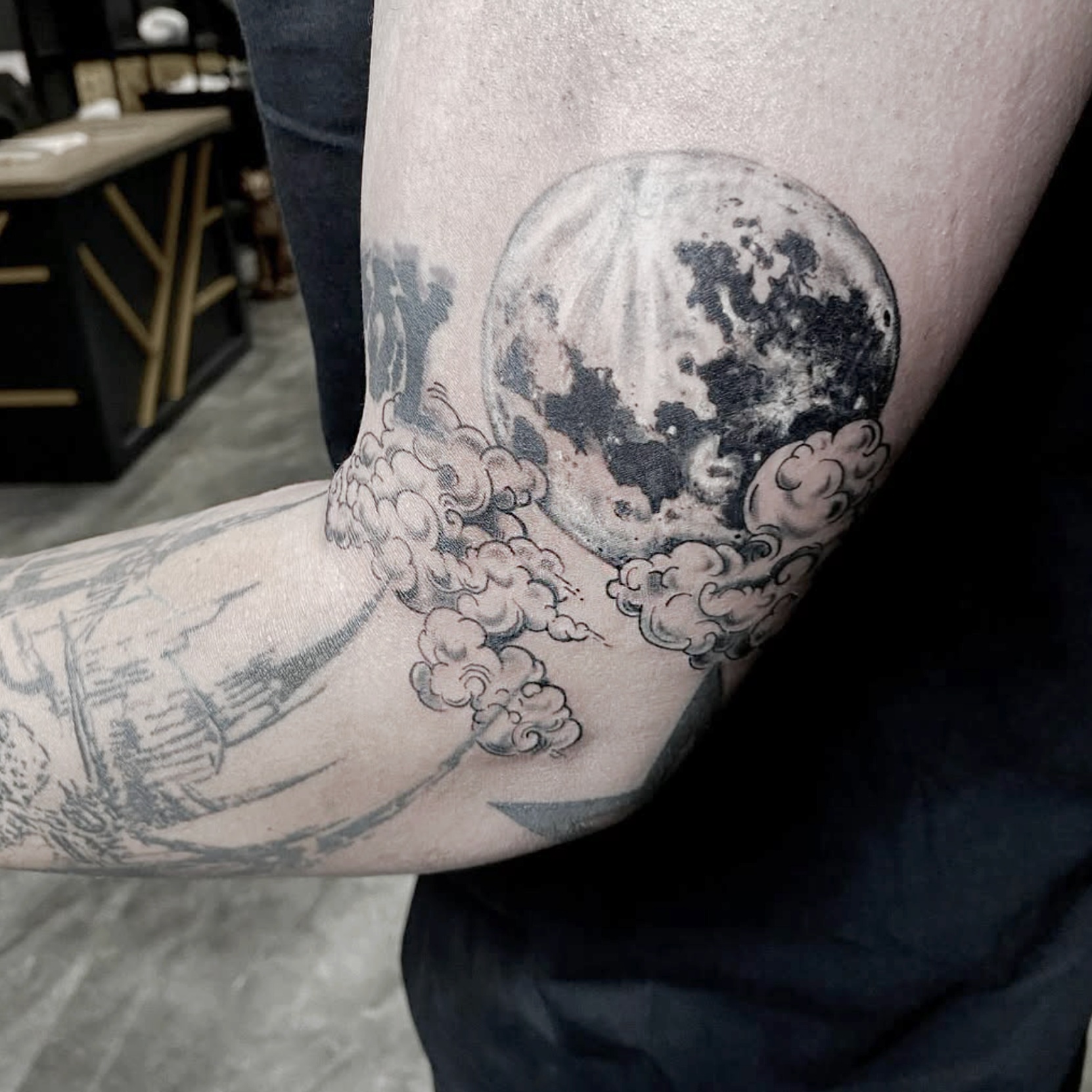 Moon and clouds black and grey tattoo on the forearm by R o s e