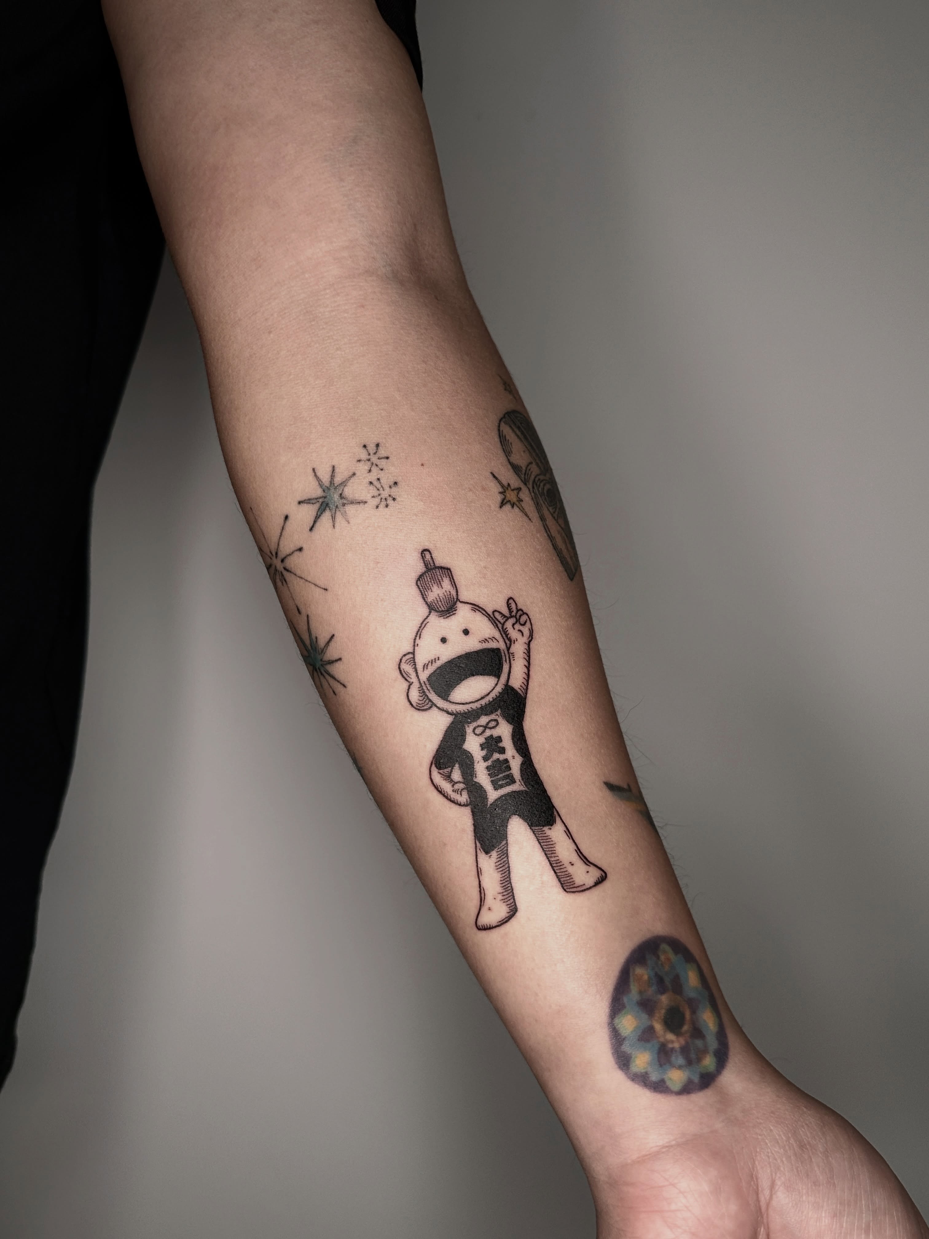 Robot black and grey tattoo on the forearm by Zecember