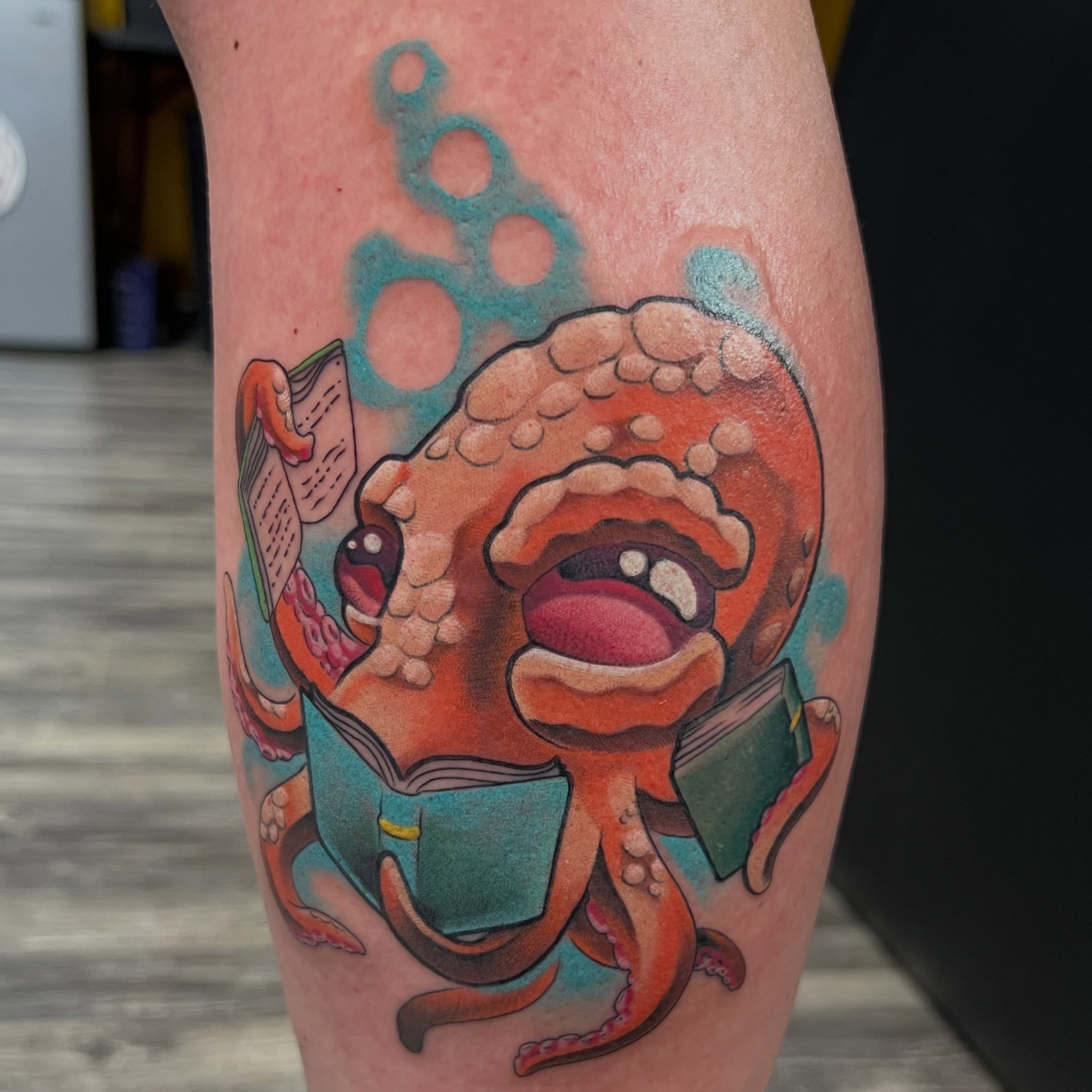 Octopus reading books new school tattoo on the forearm by Dustin Quillen Tattoo Artist, Campbellsville, Kentucky